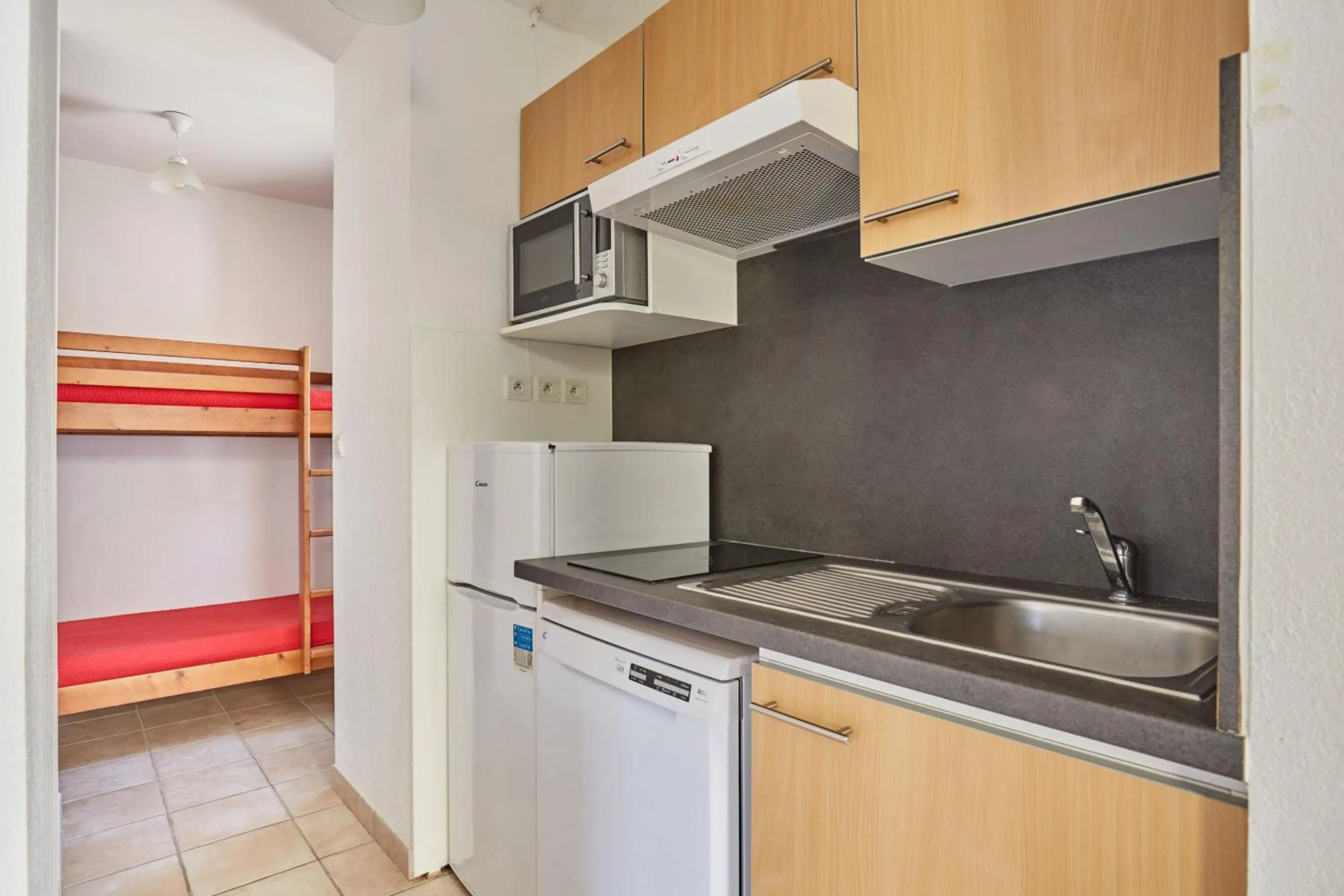 Kitchen or kitchenette in Résidence Odalys Le Hameau du Moulin