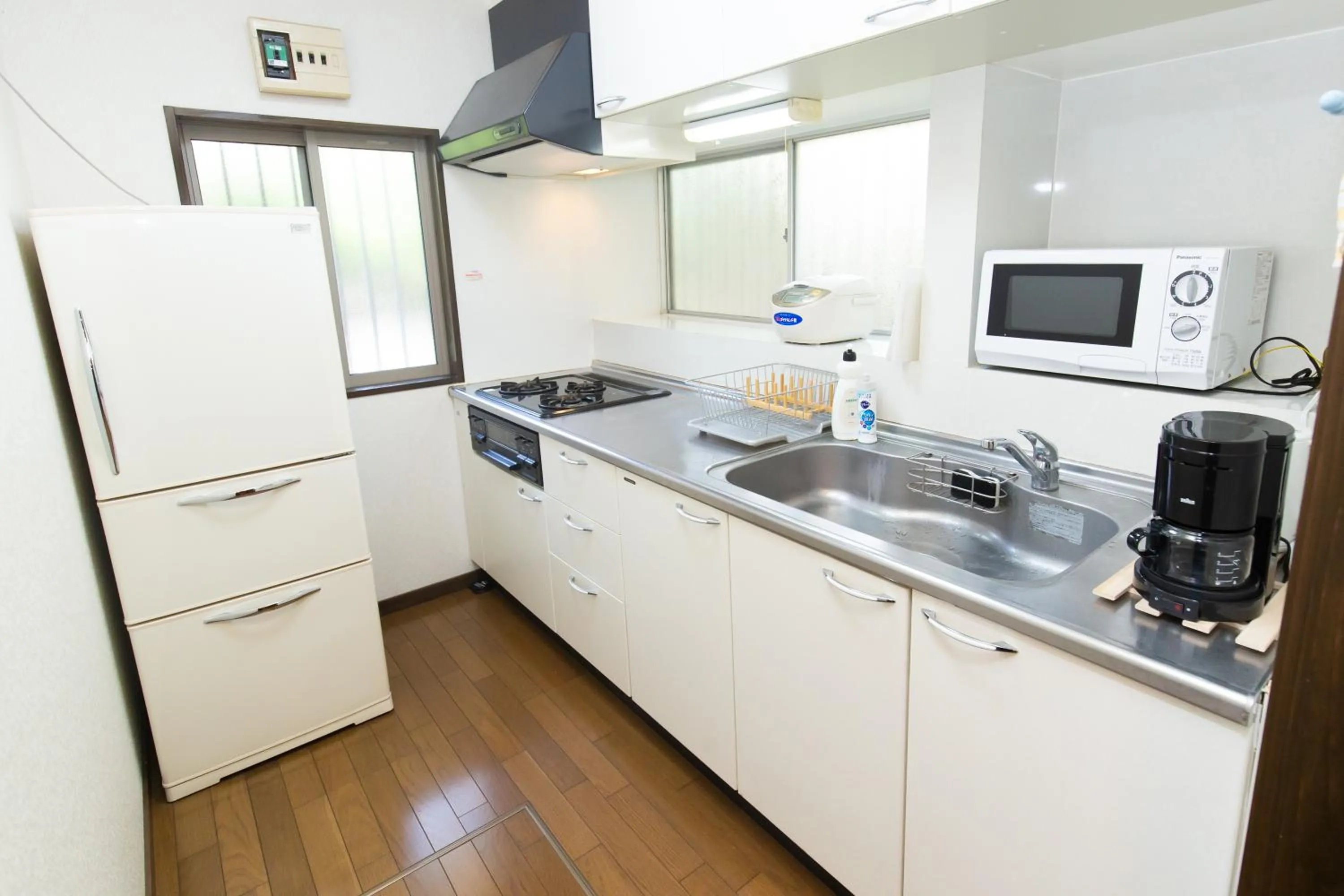 Kitchen or kitchenette in Cozy Villa with Hot springs and Nature