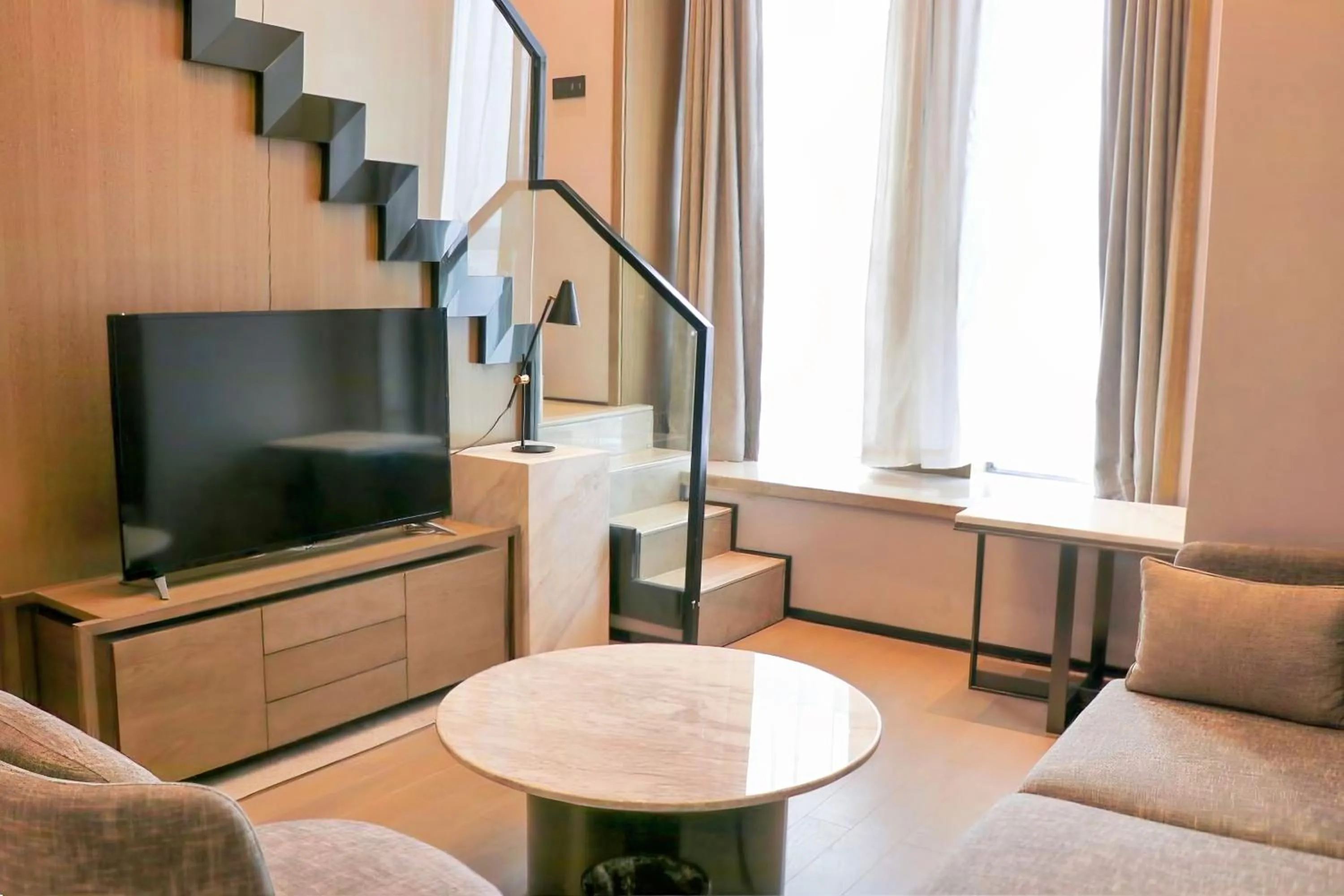 Living room in Crowne Plaza Wuhan Development Zone by IHG