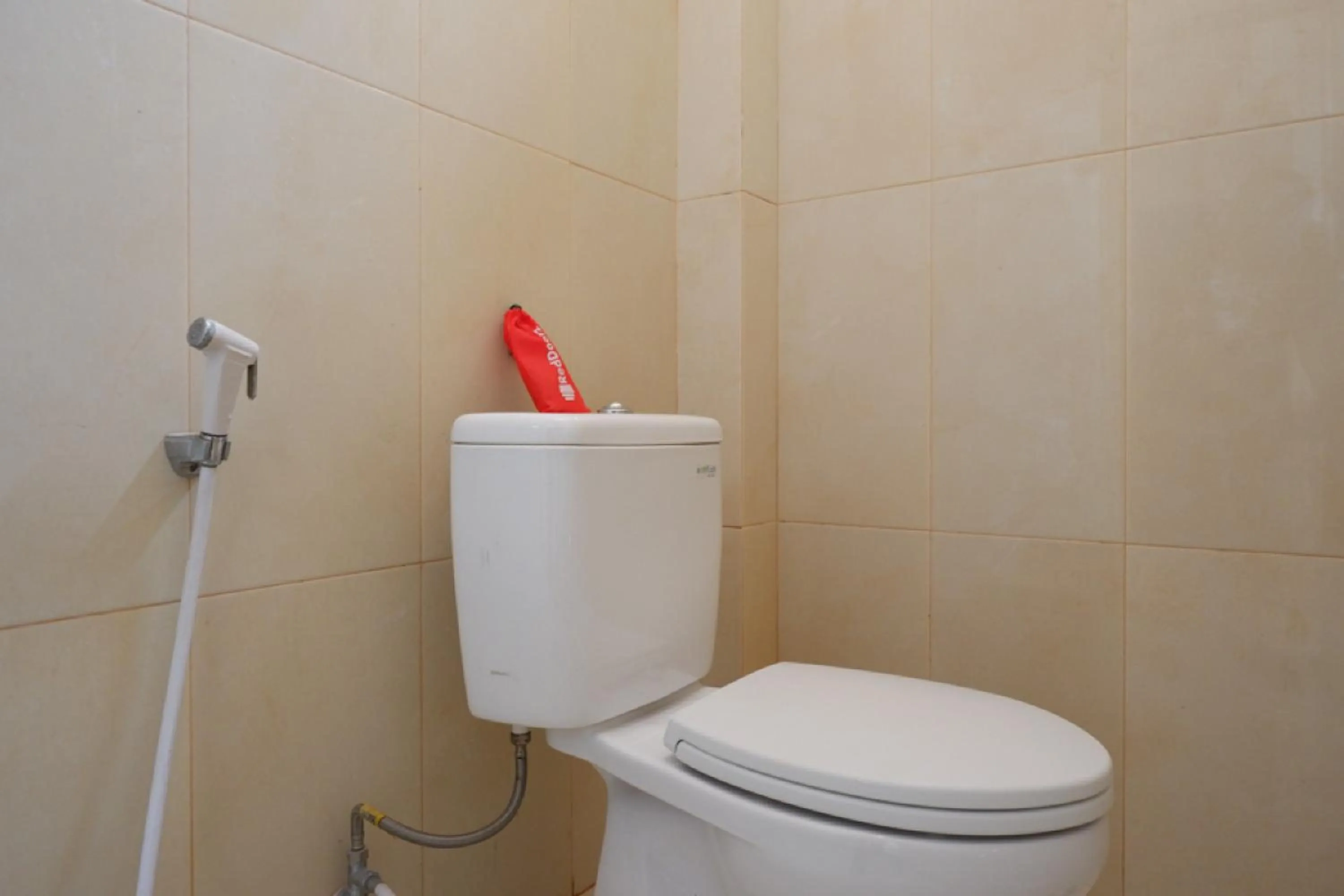 Bathroom in RedDoorz near Millenium Waterpark Palu