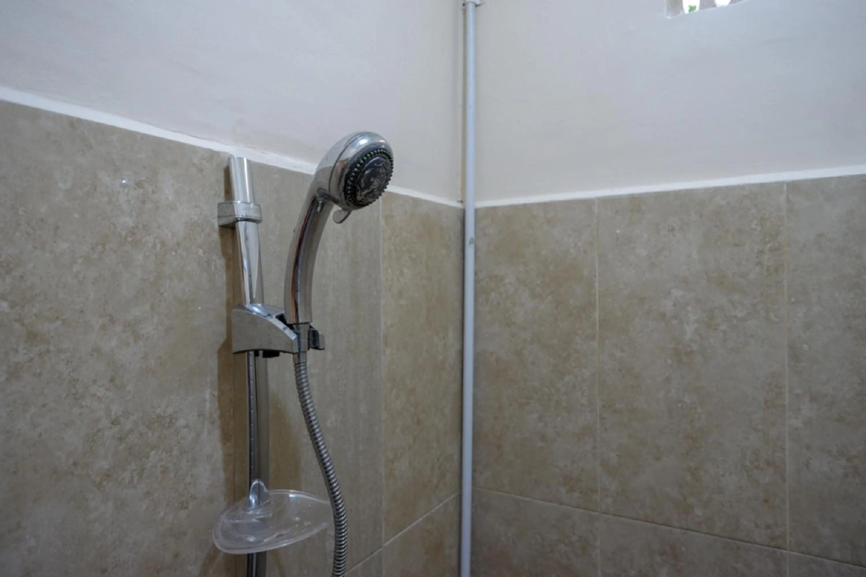 Bathroom in RedDoorz near Millenium Waterpark Palu