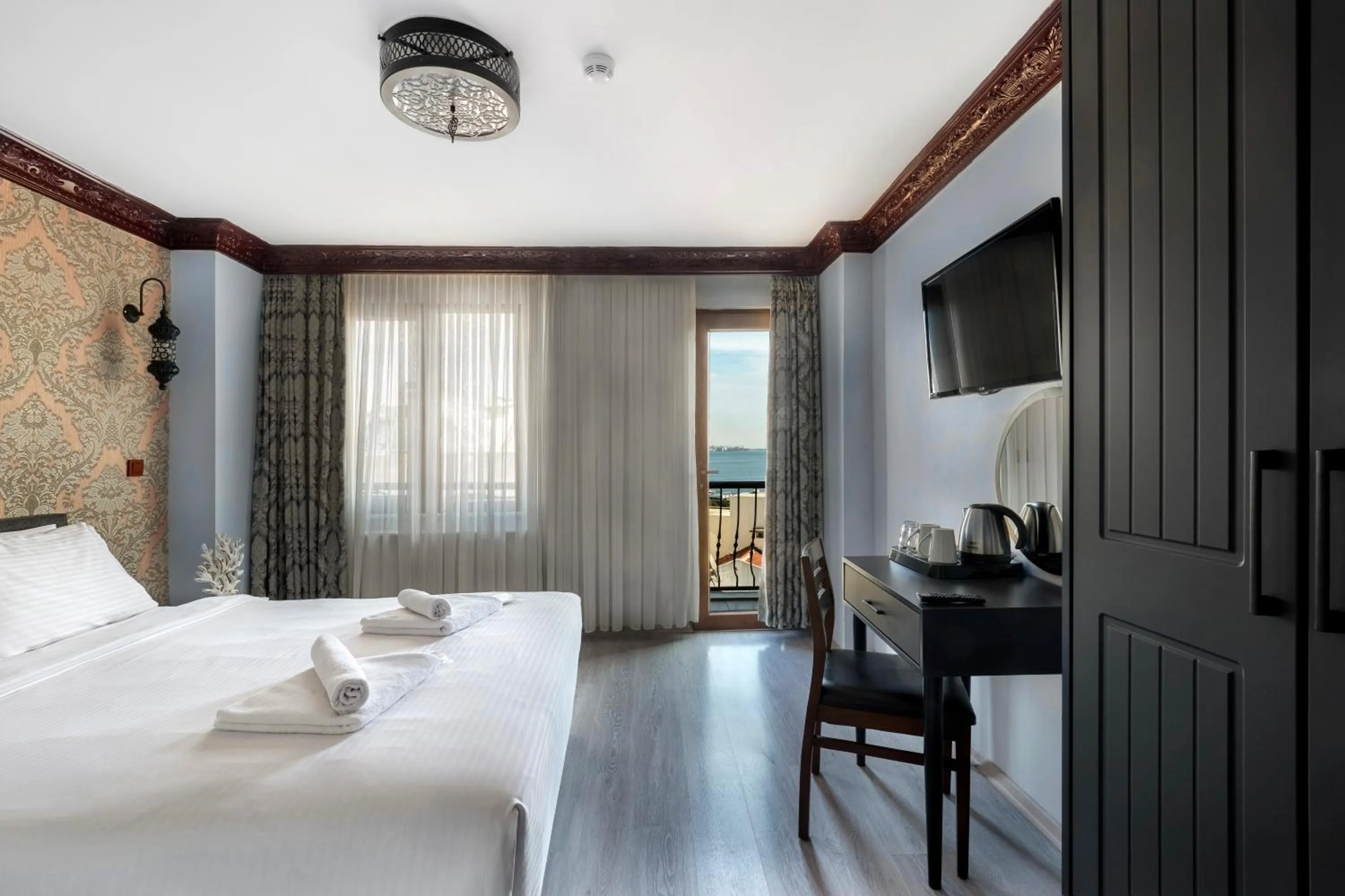 TV and multimedia, Bed in Mytra Hotel