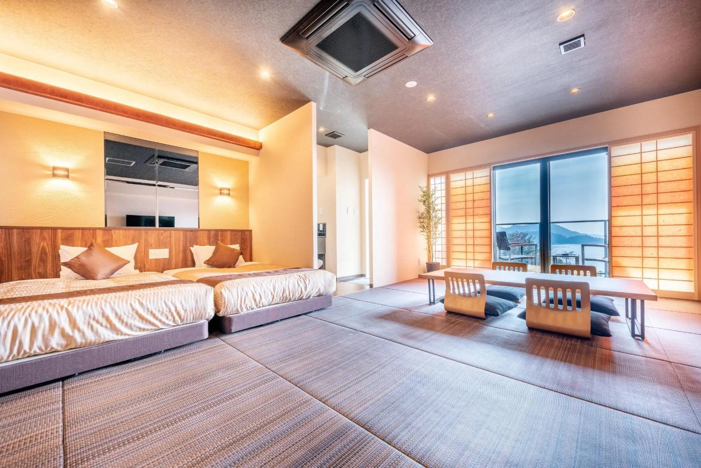 Bed in LiVEMAX RESORT Miyahama Ocean View