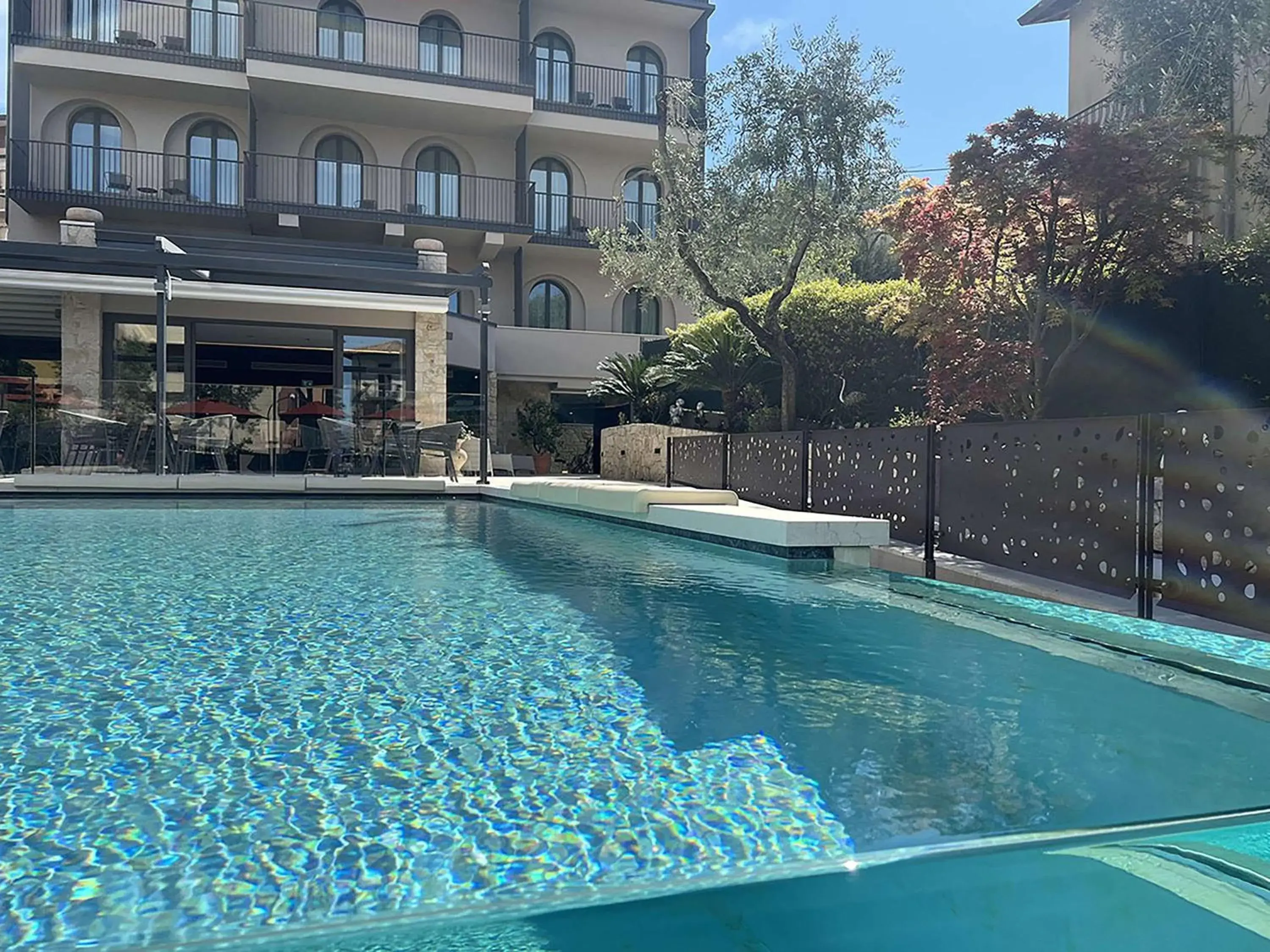 Pool view in Hotel Ristorante Al Caminetto WorldHotels Crafted Adults Only Pool view in Hotel Ristorante Al Caminetto WorldHotels Crafted Adults Only