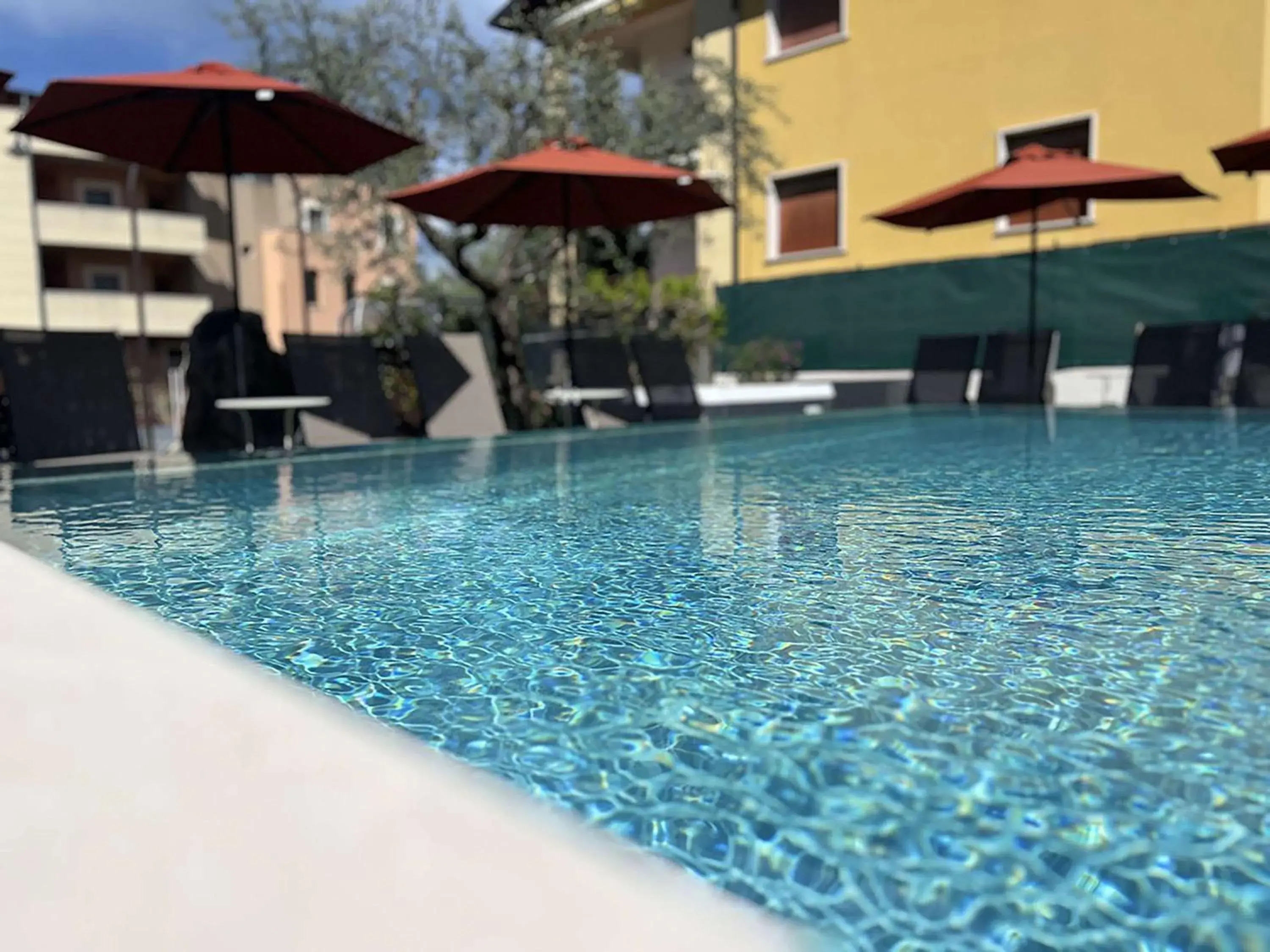 Pool view in Hotel Ristorante Al Caminetto WorldHotels Crafted Adults Only Pool view in Hotel Ristorante Al Caminetto WorldHotels Crafted Adults Only