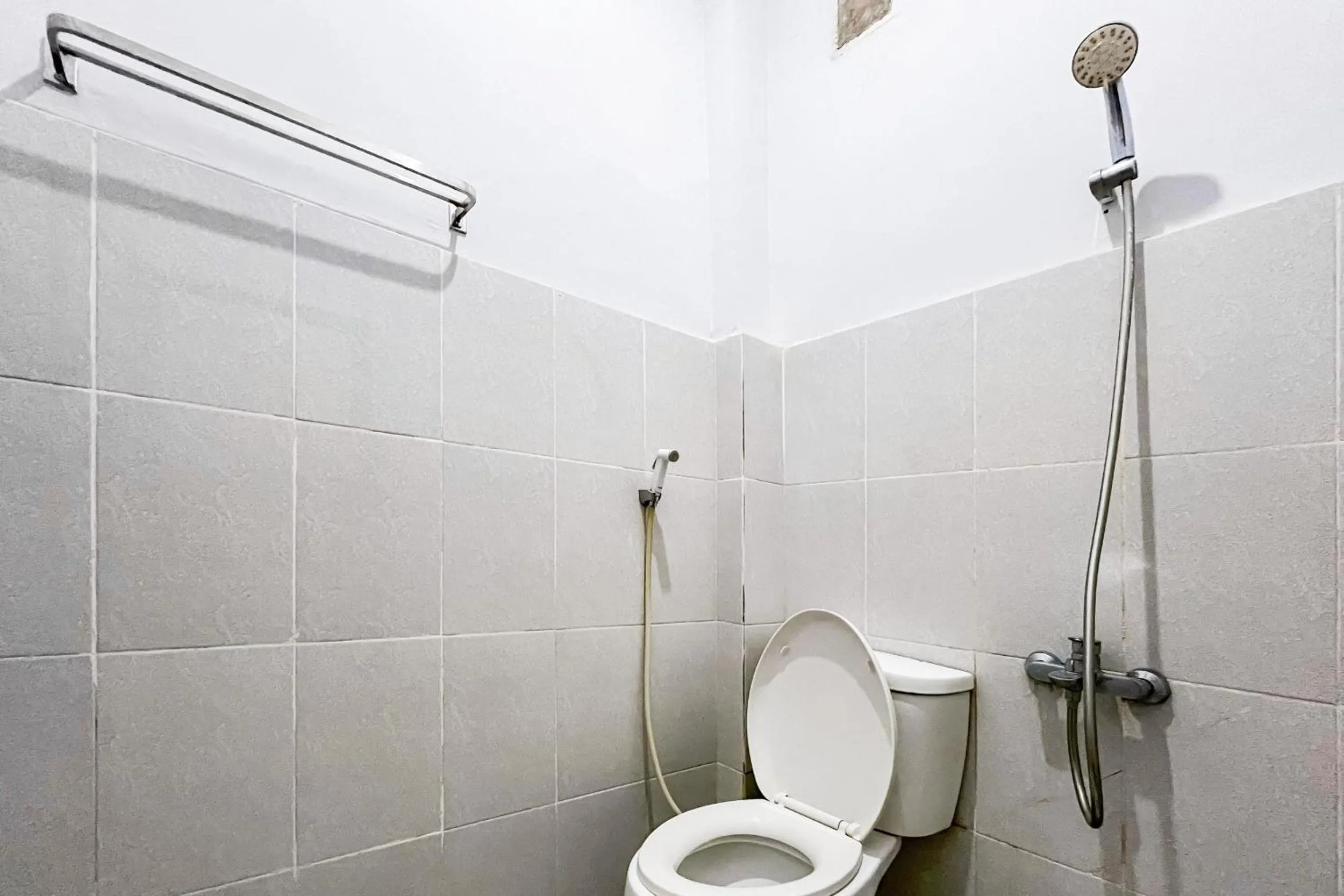 Bathroom in RedDoorz Plus at Hotel Lestari Karema Mamuju