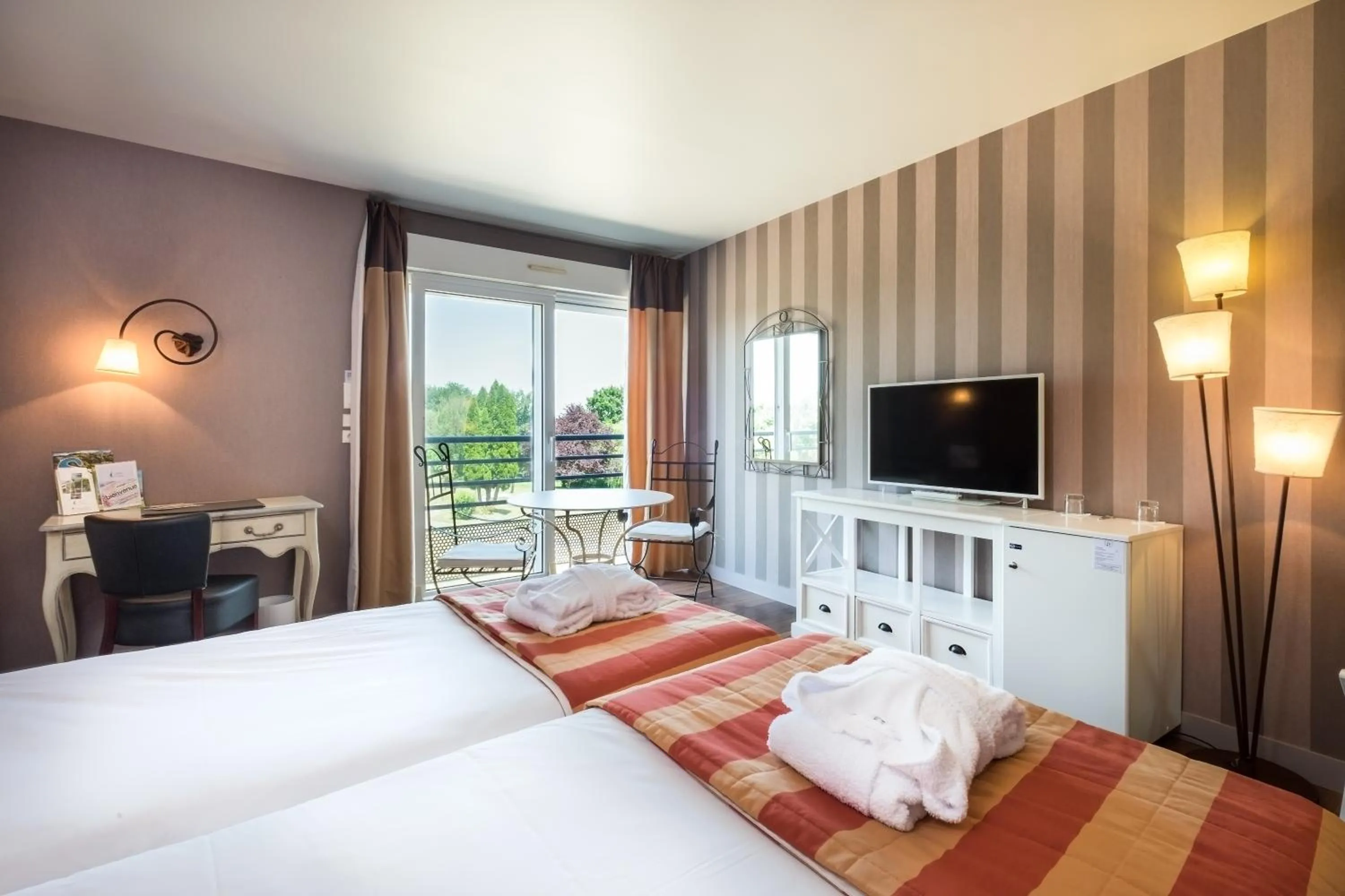 Photo of the whole room, Bed in Logis L'Ermitage Hôtel & Restaurant