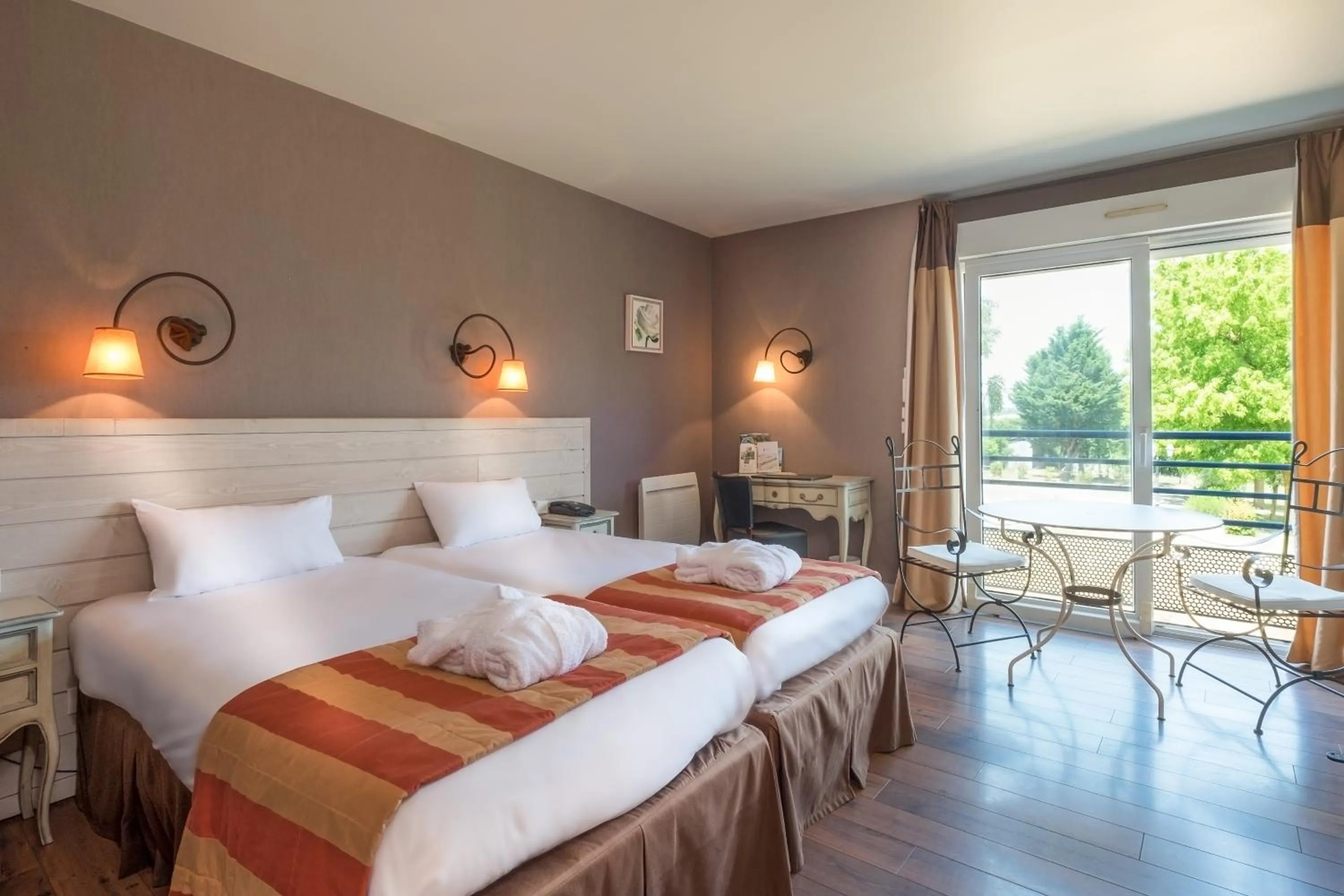 Photo of the whole room, Bed in Logis L'Ermitage Hôtel & Restaurant