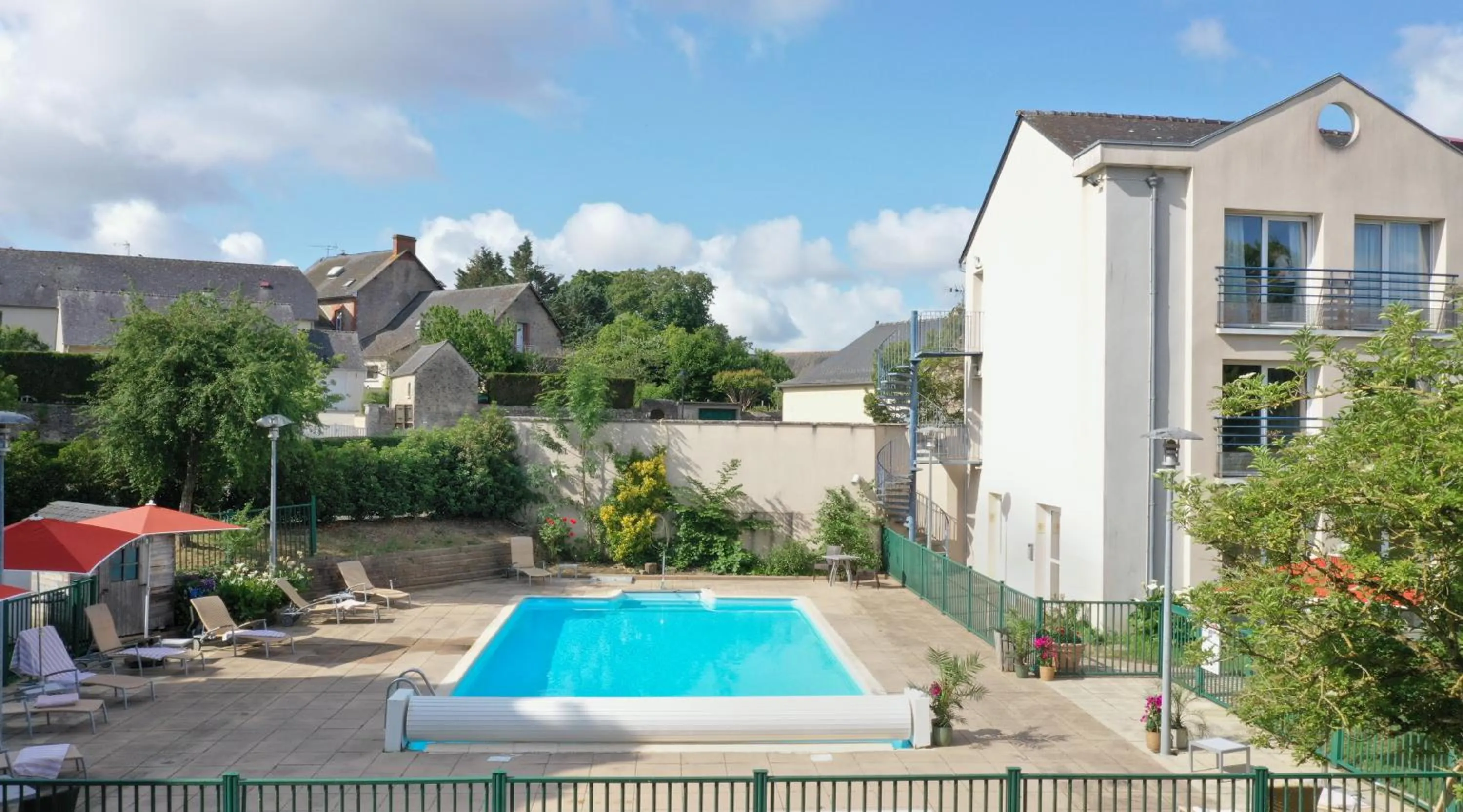 Swimming pool in Logis L'Ermitage Hôtel & Restaurant