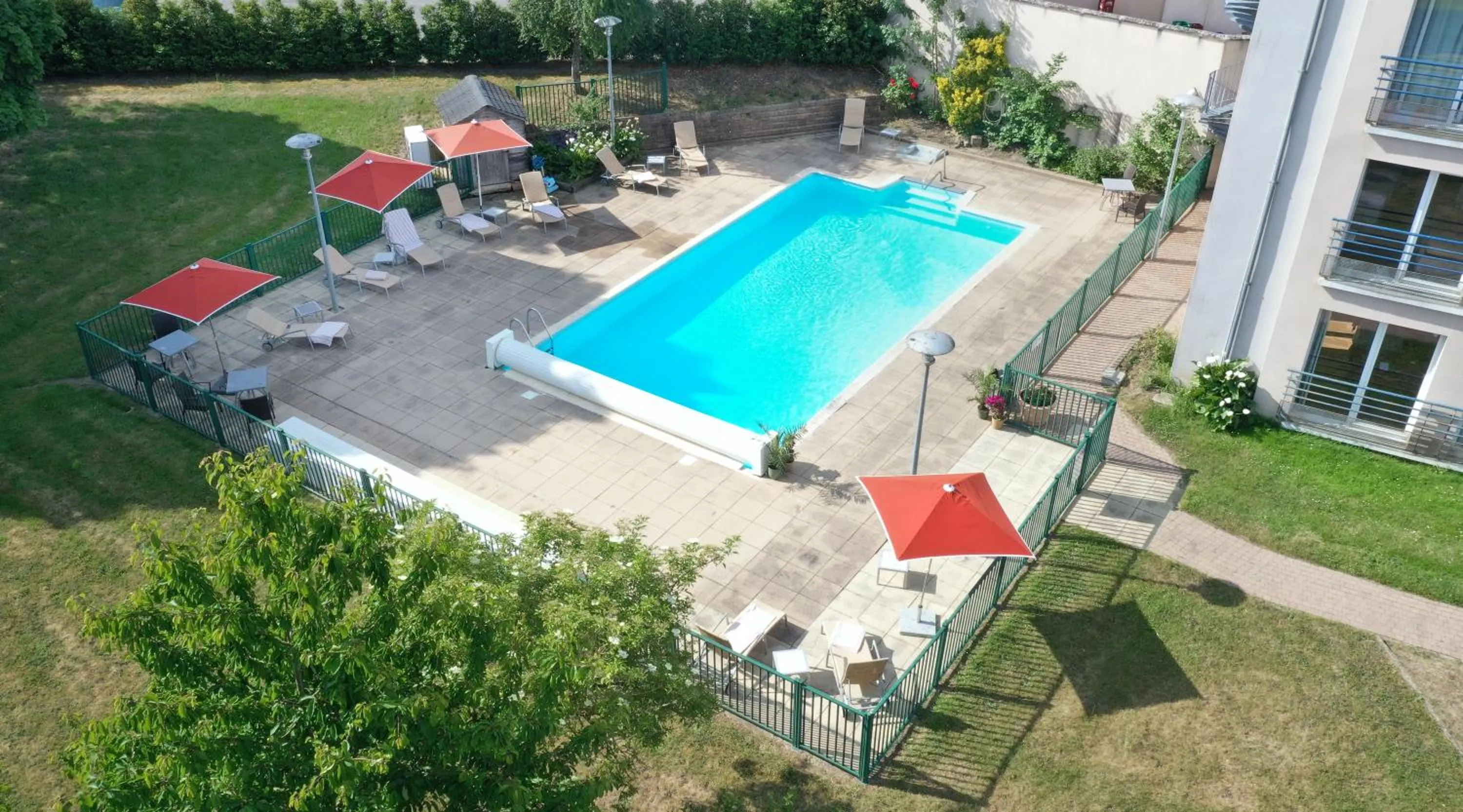 Swimming pool in Logis L'Ermitage Hôtel & Restaurant