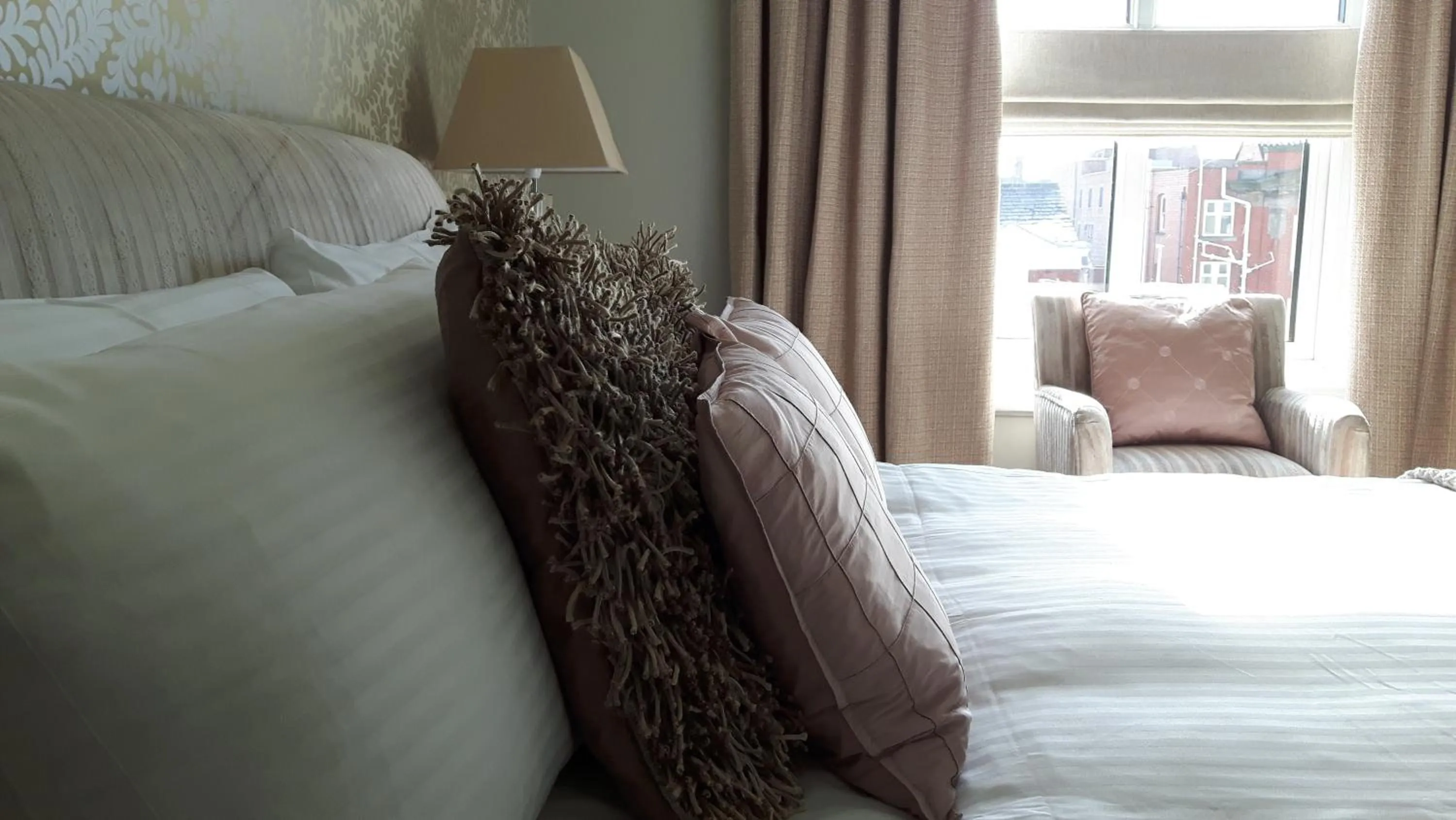 Bed in The Ambassador Townhouse