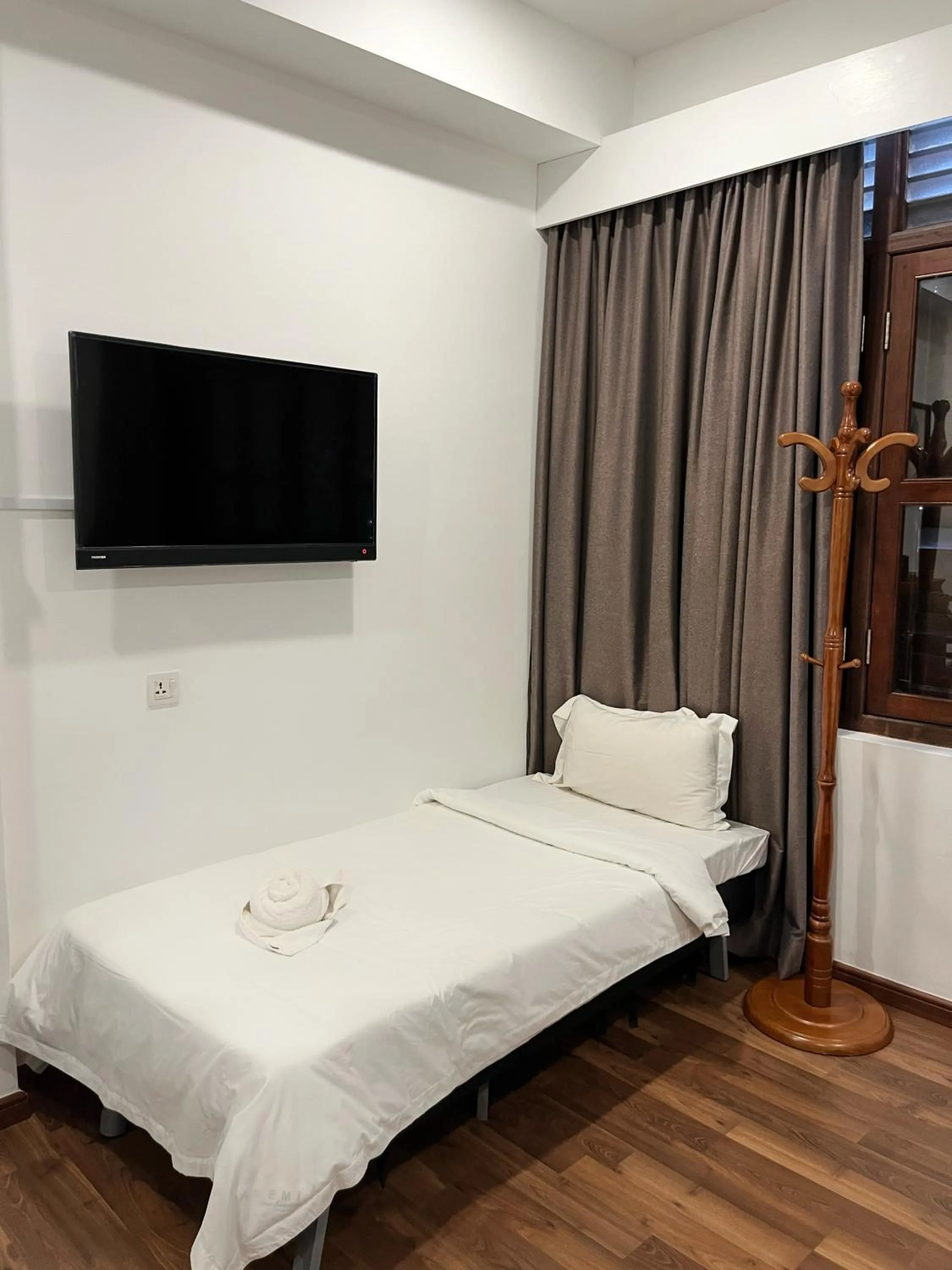 Bed in Mclane Boutique Hotel