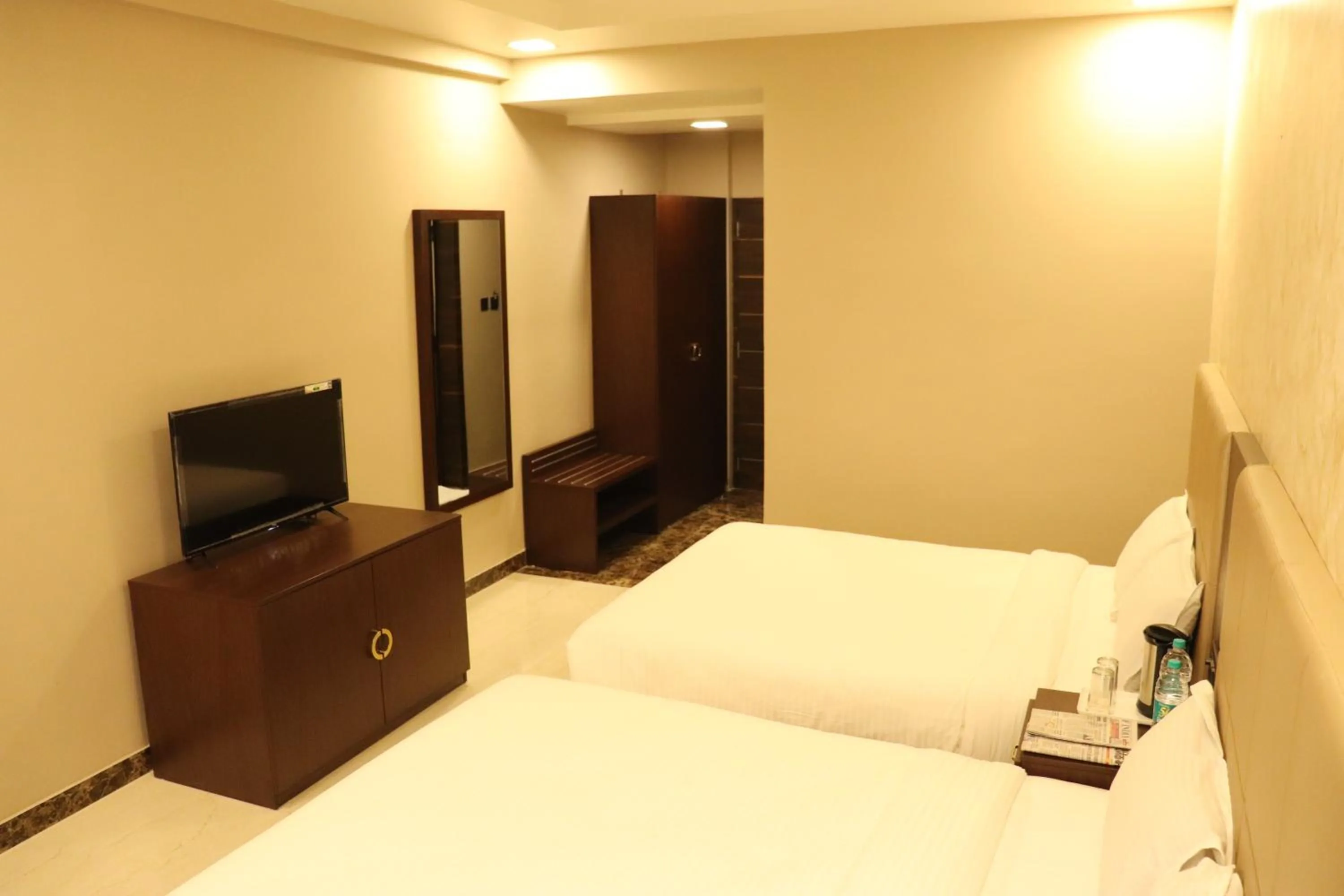 Bed in Mangal Grand Hotel