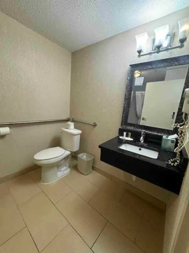 Bathroom in Ramada Plaza by Wyndham Charlotte South End Airport
