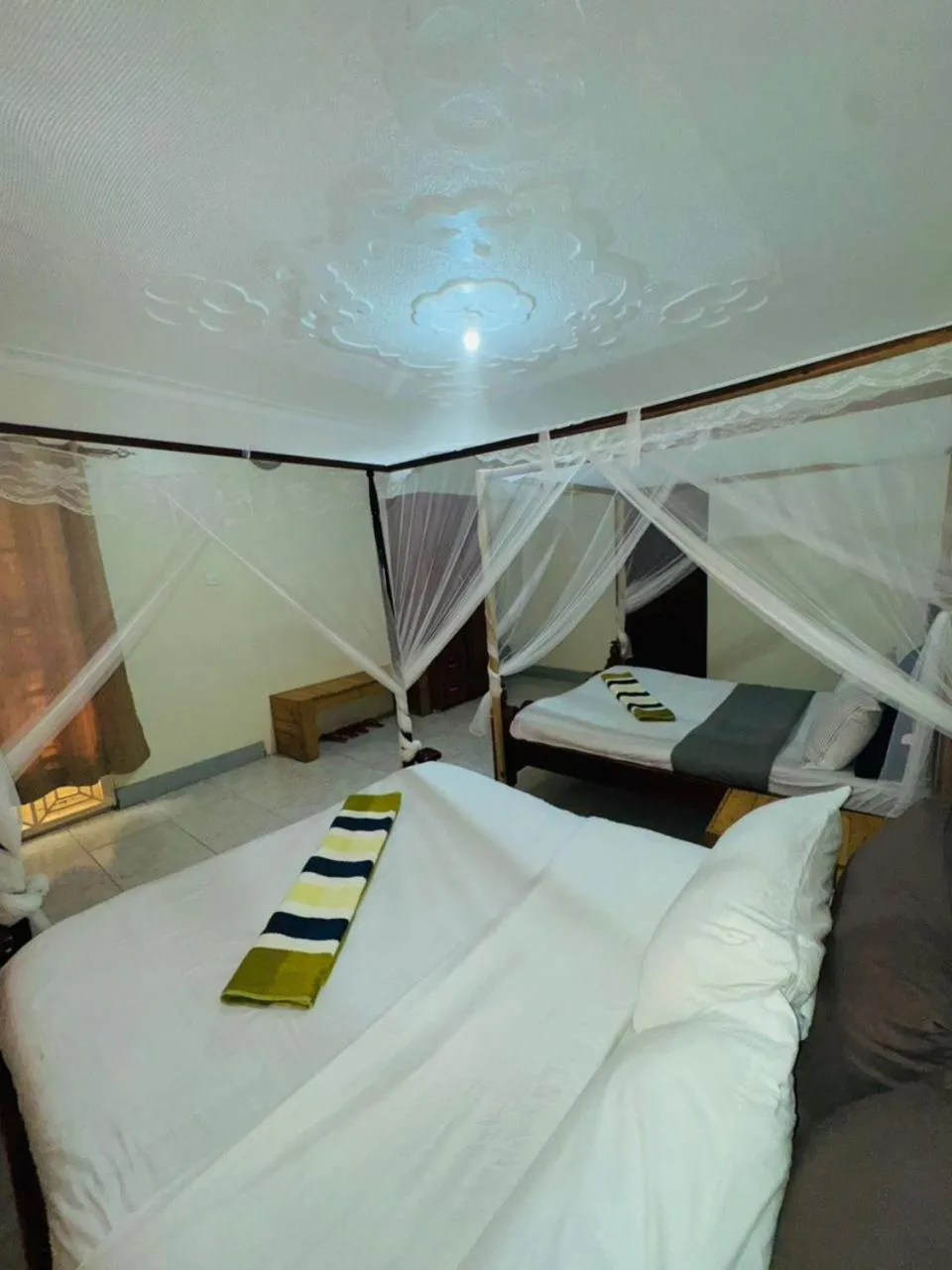 Bed in Acacia Villa Kampala
