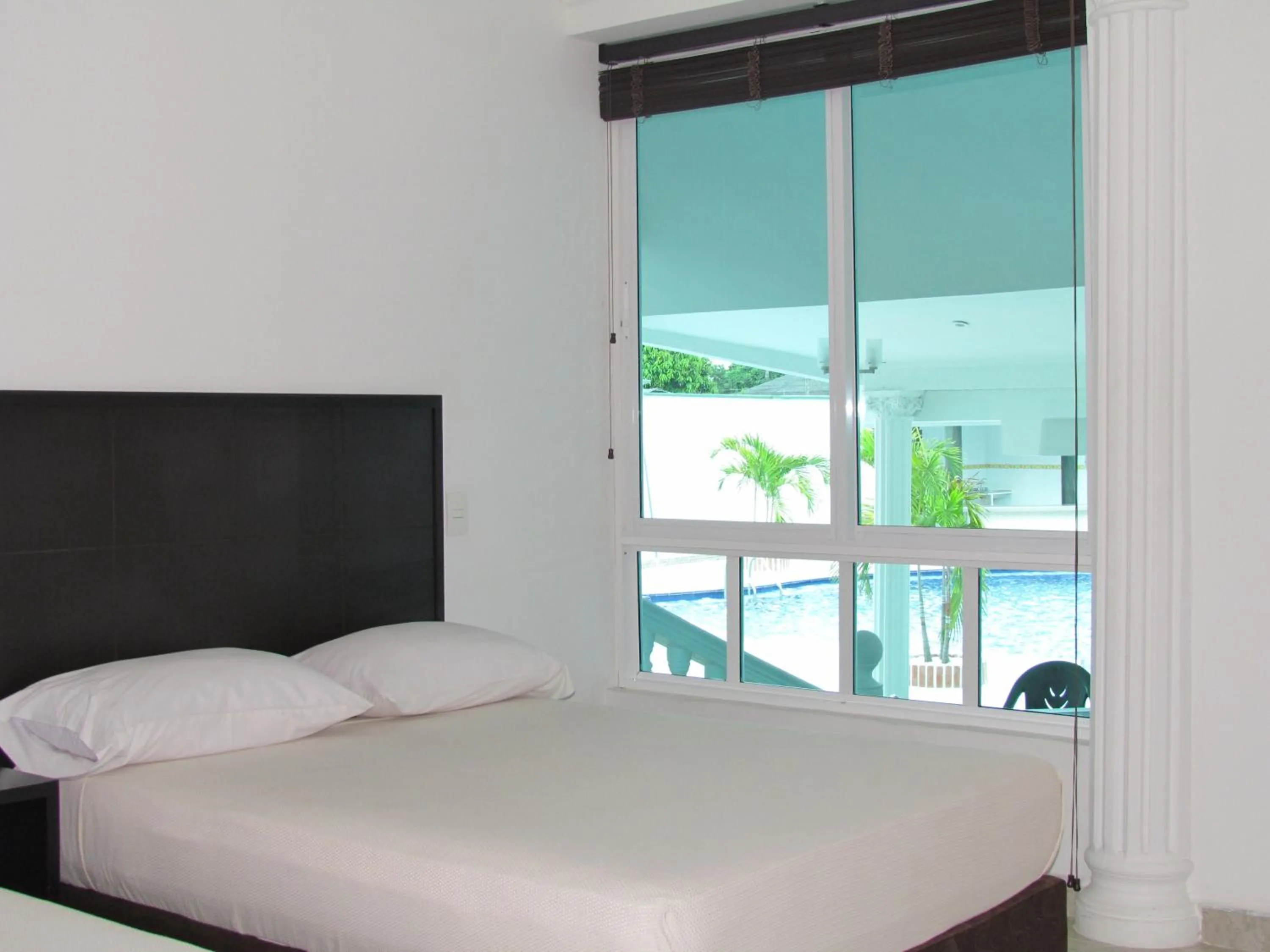 Bed in Hotel Iraqúa