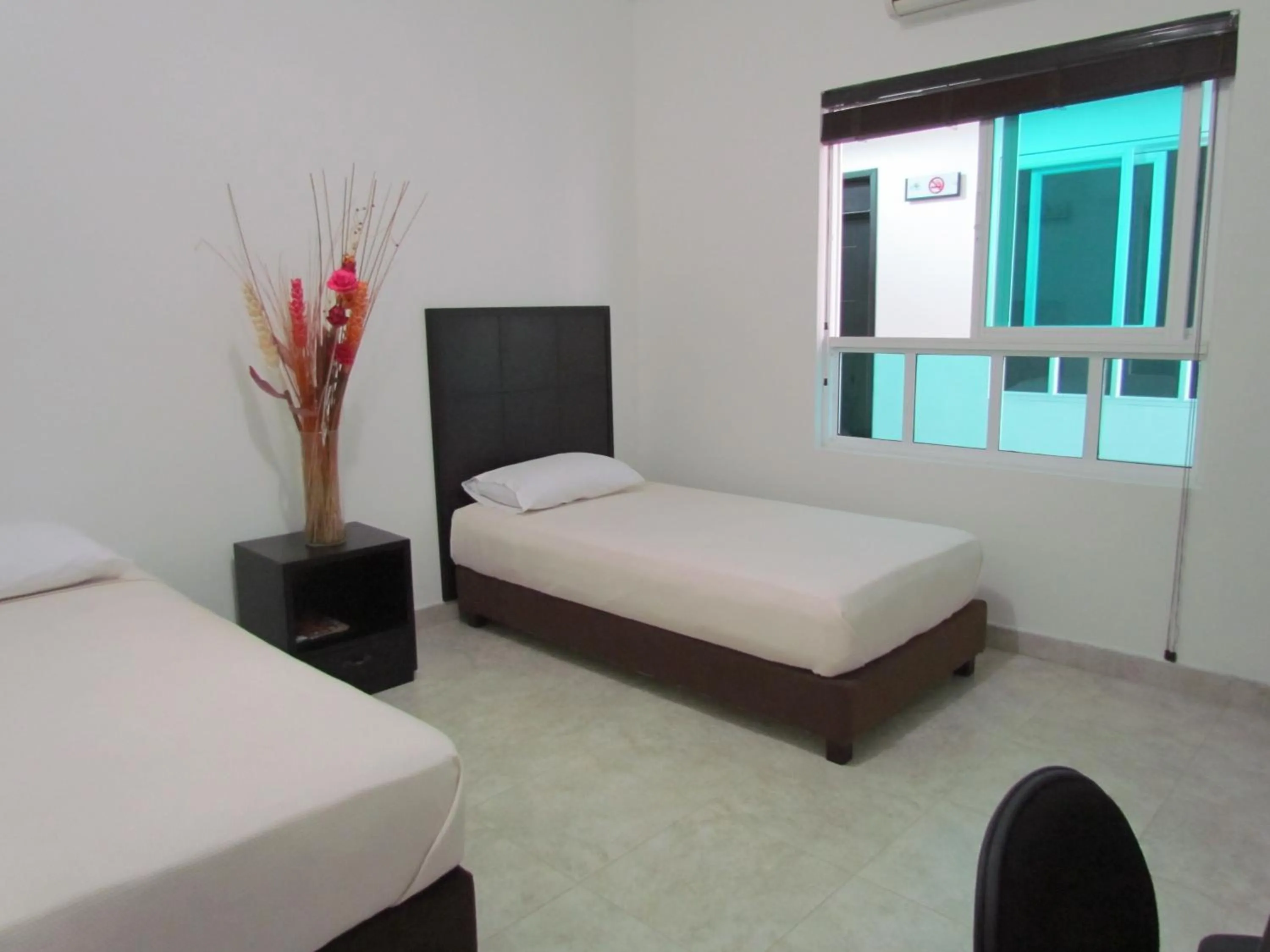 Bed in Hotel Iraqúa