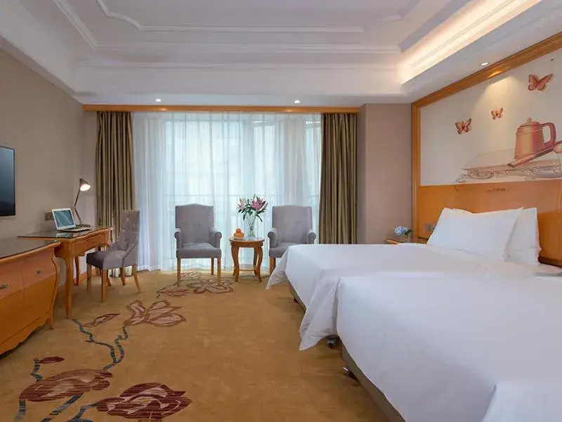 Bed in Vienna International Hotel (Fangchenggang Administration Center High-speed Railway Station branch) Bed in Vienna International Hotel (Fangchenggang Administration Center High-speed Railway Station branch)