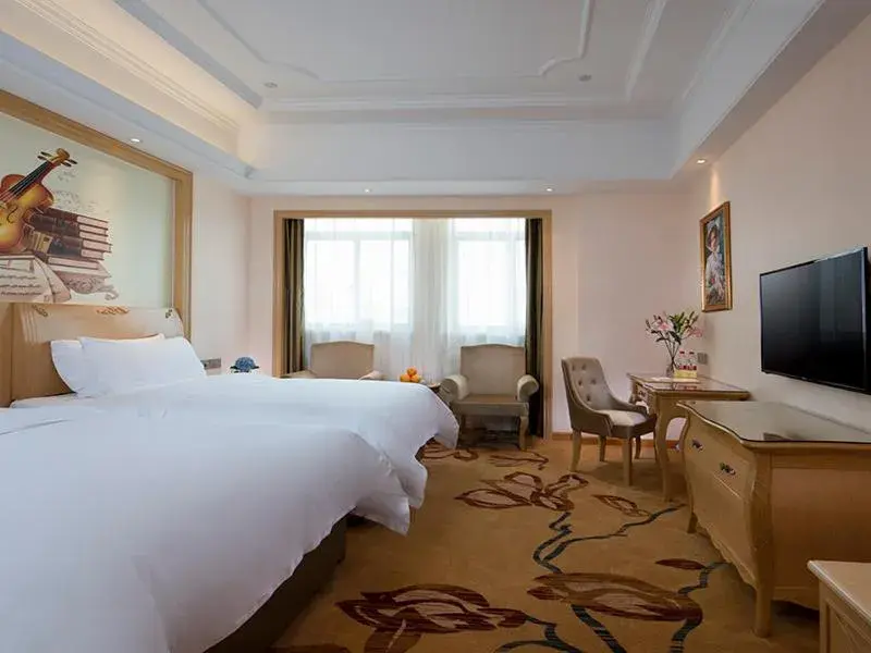 Bed in Vienna International Hotel (Fangchenggang Administration Center High-speed Railway Station branch) Bed in Vienna International Hotel (Fangchenggang Administration Center High-speed Railway Station branch)