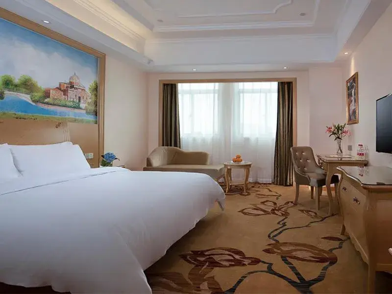 Bed in Vienna International Hotel (Fangchenggang Administration Center High-speed Railway Station branch) Bed in Vienna International Hotel (Fangchenggang Administration Center High-speed Railway Station branch)