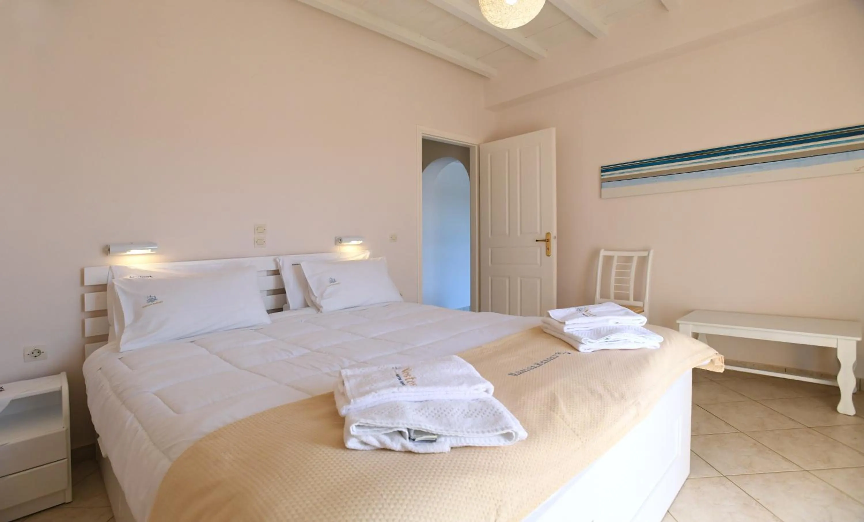 Bed in Nostos Beachfront Apartments & Studios