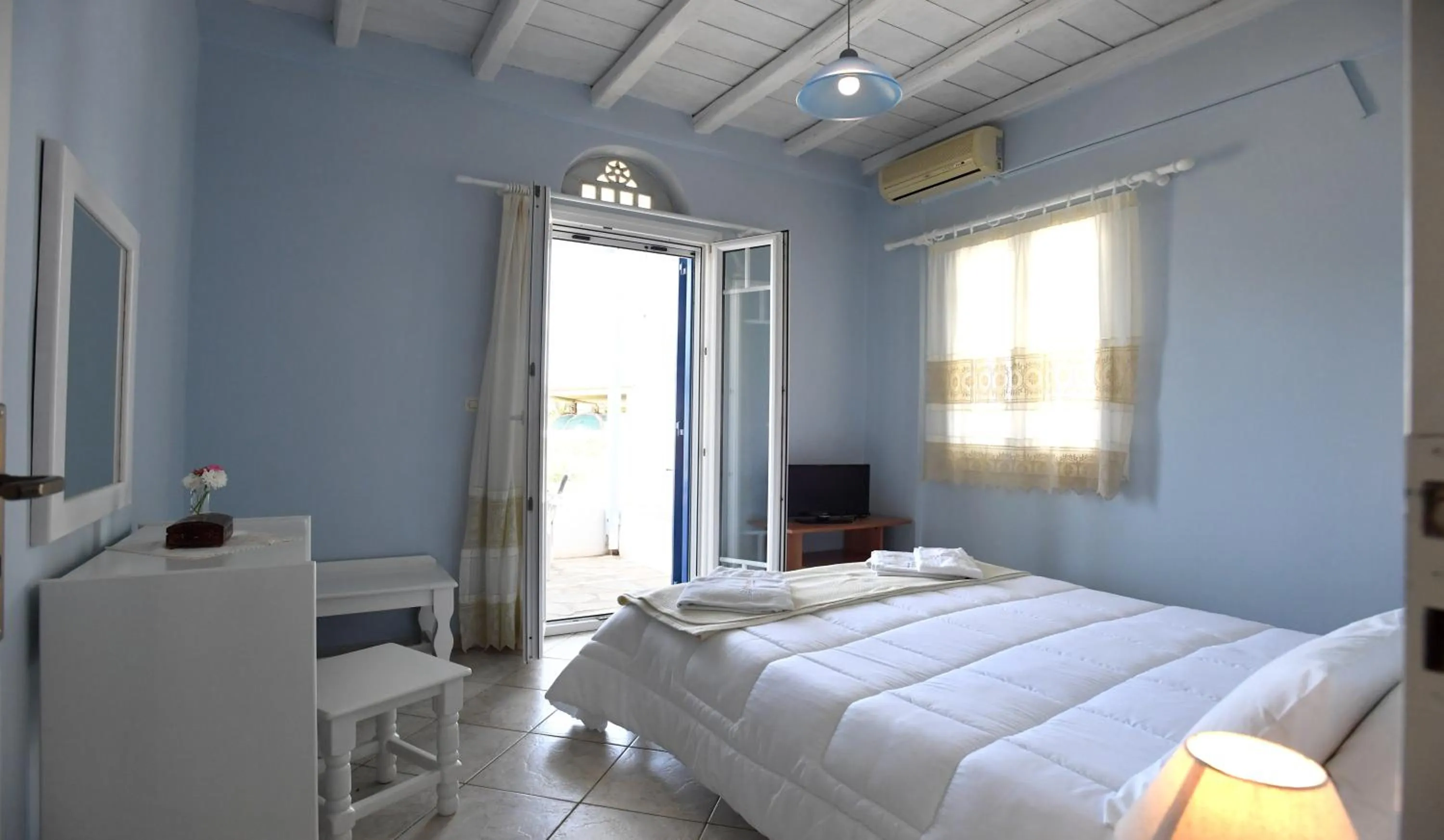 Bed in Nostos Beachfront Apartments & Studios