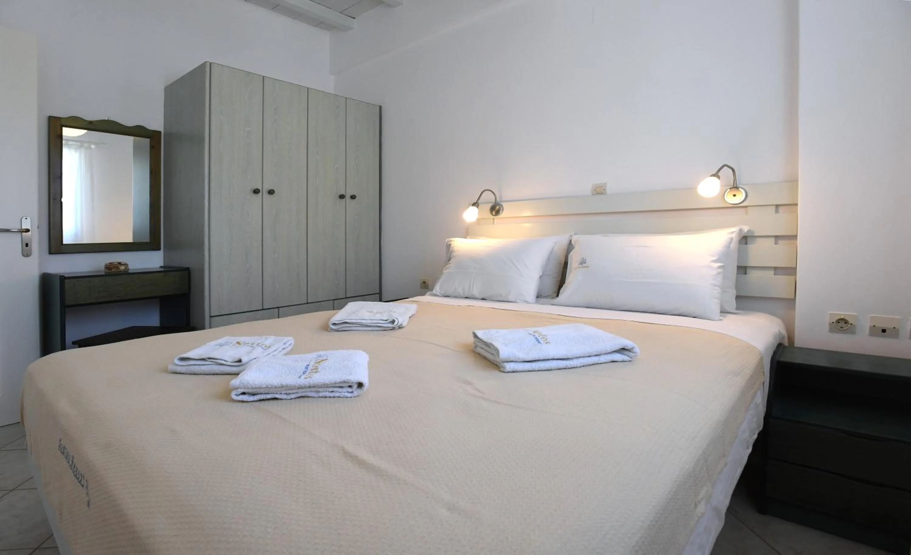 Bed in Nostos Beachfront Apartments & Studios