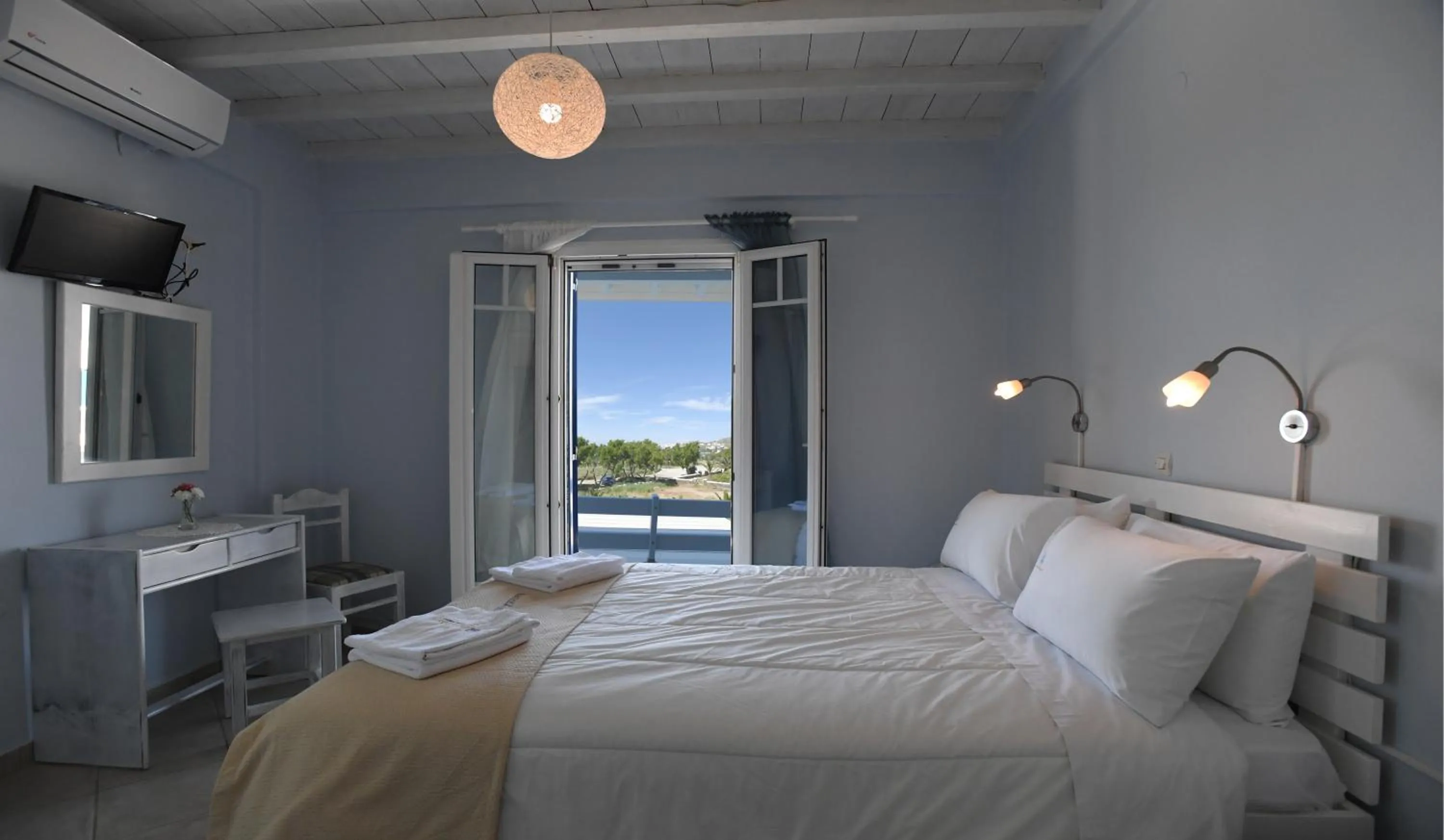 Bed in Nostos Beachfront Apartments & Studios