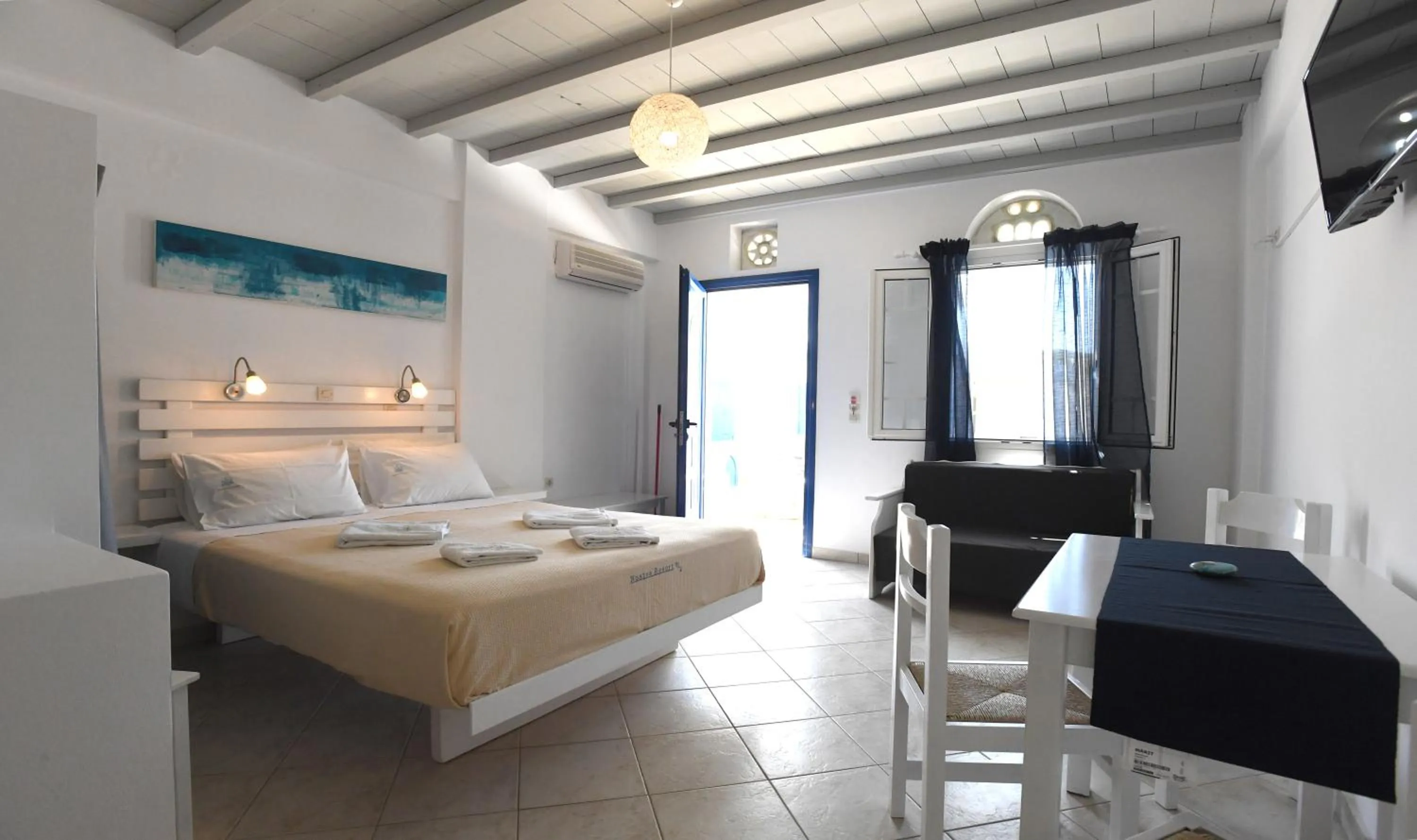 Bed in Nostos Beachfront Apartments & Studios