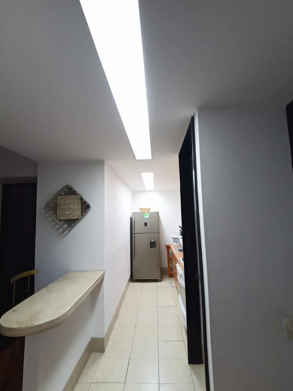 Kitchen or kitchenette in Puerta Alameda Suites México