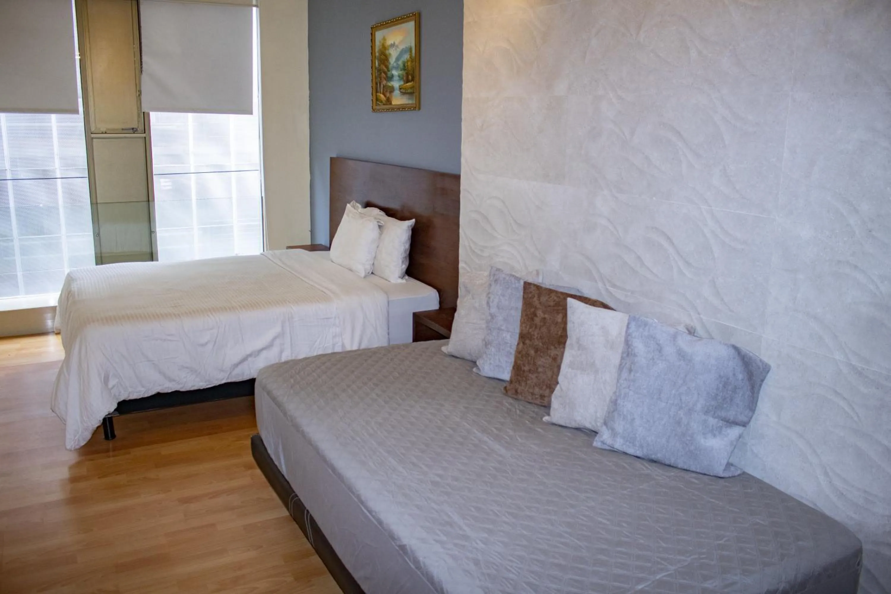 Bed in Puerta Alameda Suites México