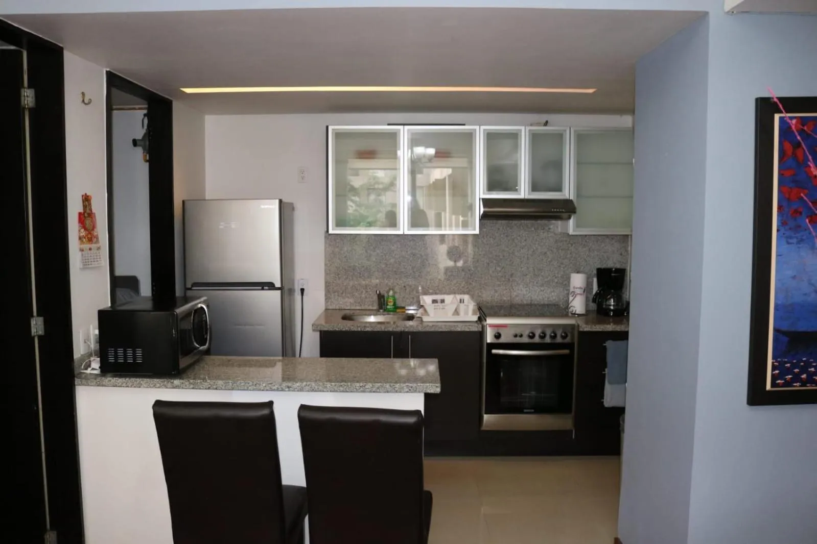 Kitchen or kitchenette in Puerta Alameda Suites México