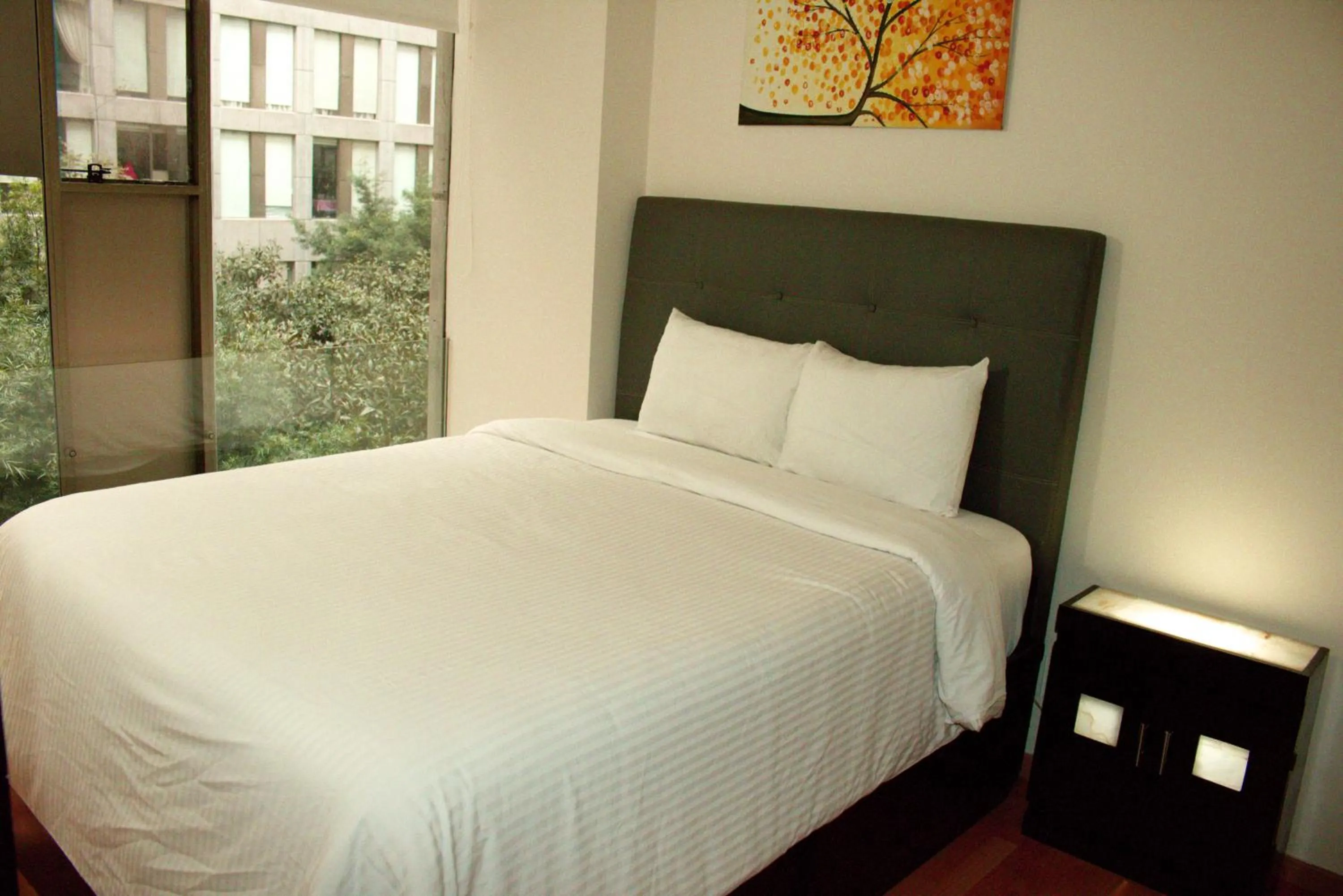 Bed in Puerta Alameda Suites México