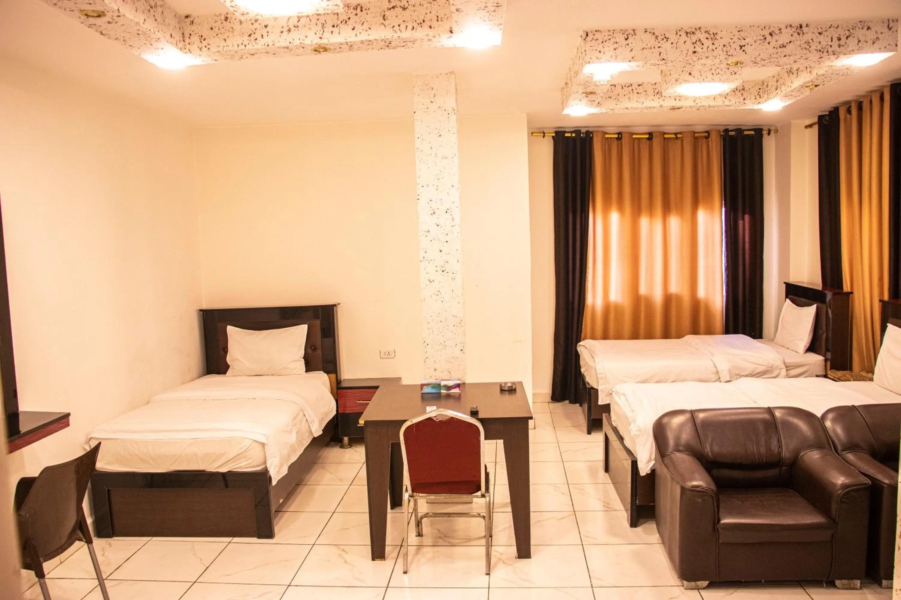 Bed in Sara Crown Hotel