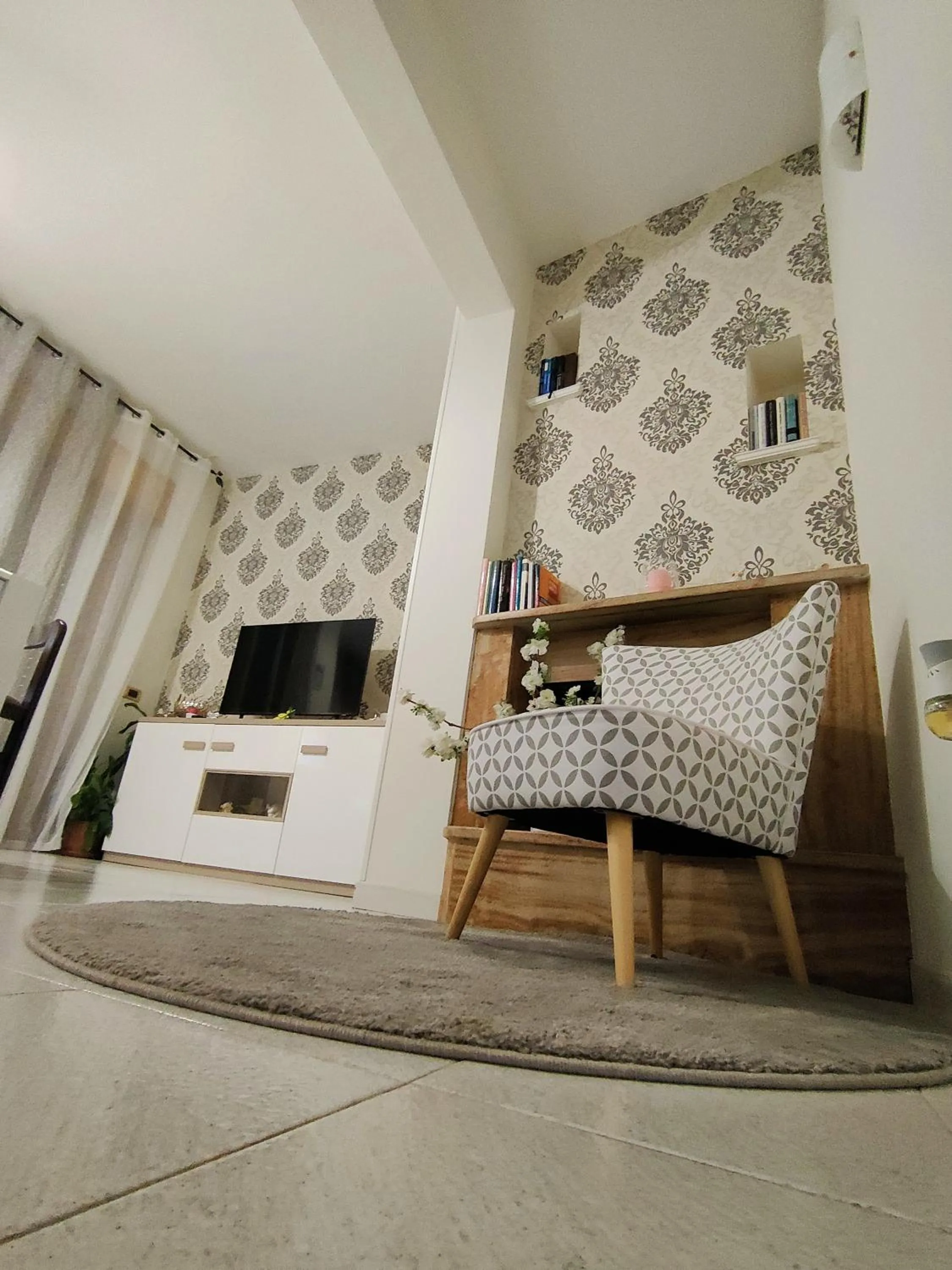 Communal lounge/ TV room in B&B Mariele