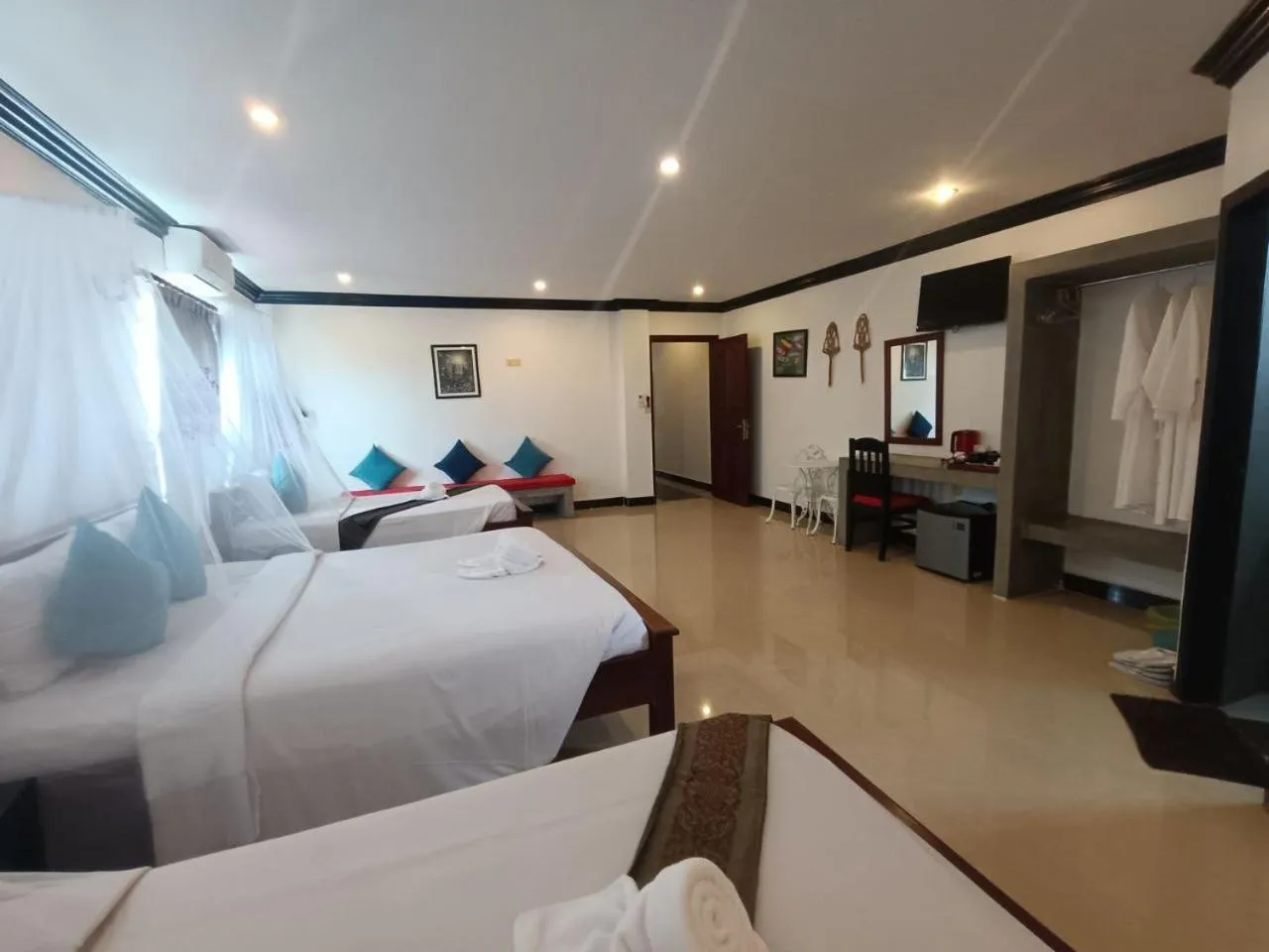 Bed in Parent Heritage Angkor Villa