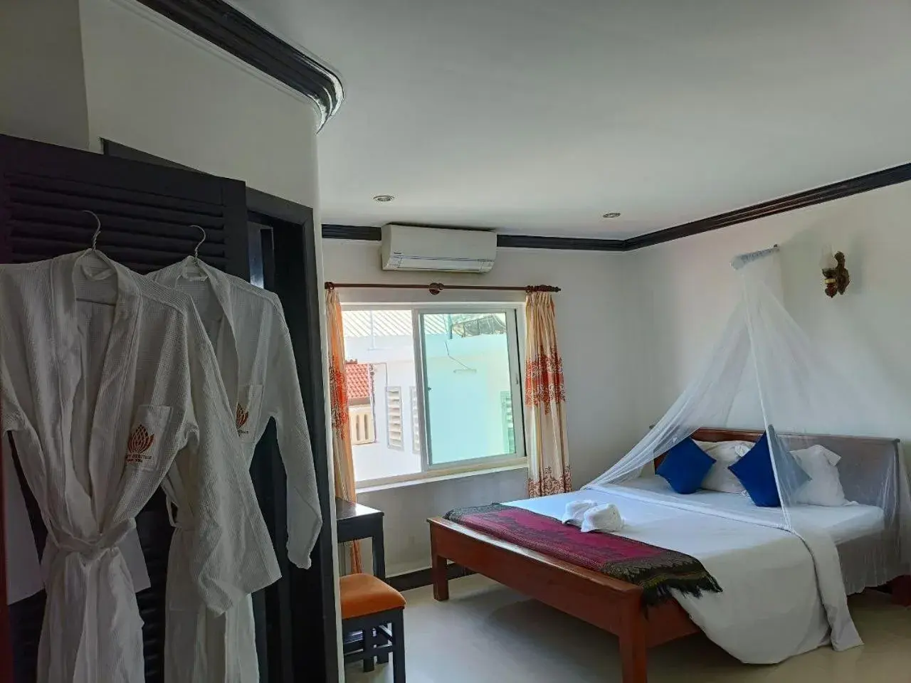 Bed in Parent Heritage Angkor Villa Bed in Parent Heritage Angkor Villa