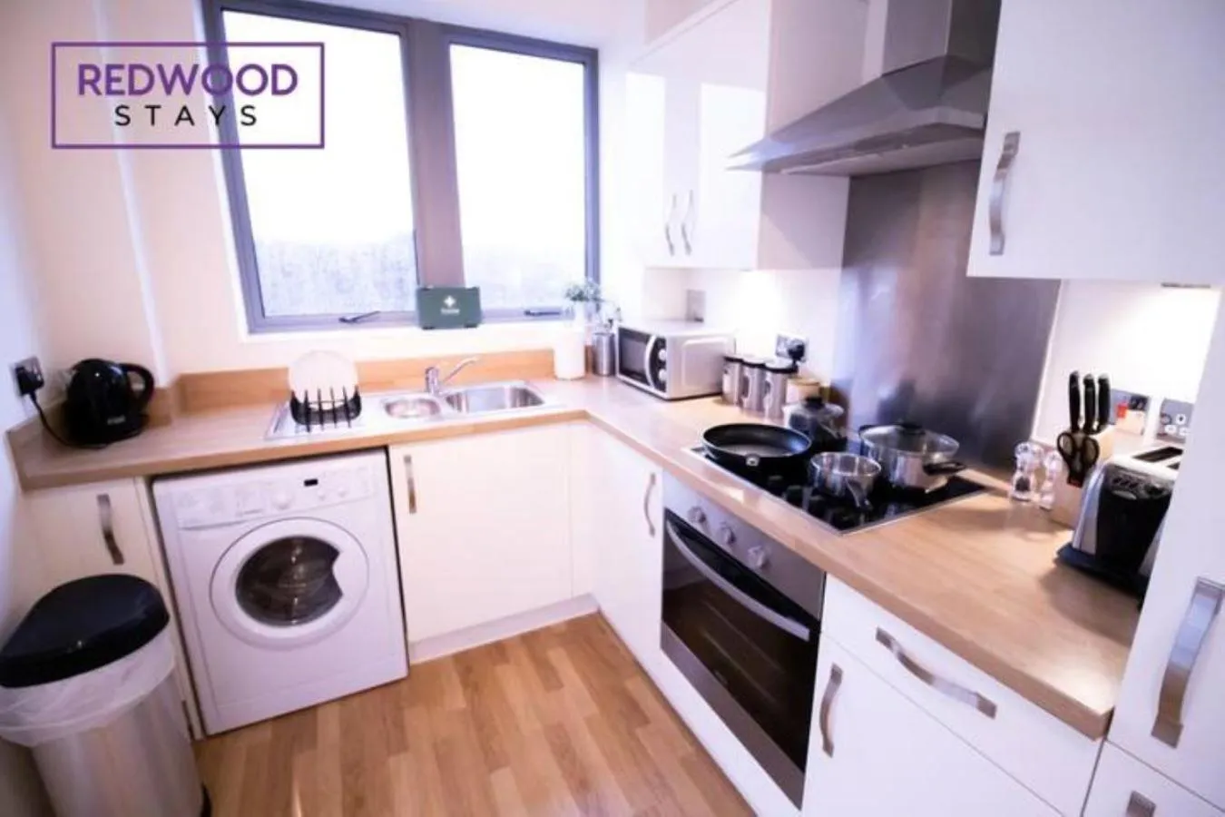kitchen in Festival Place, Modern Town Center Apartment, Perfect for Contractors & Families, FREE Parking & WiFi by REDWOOD STAYS