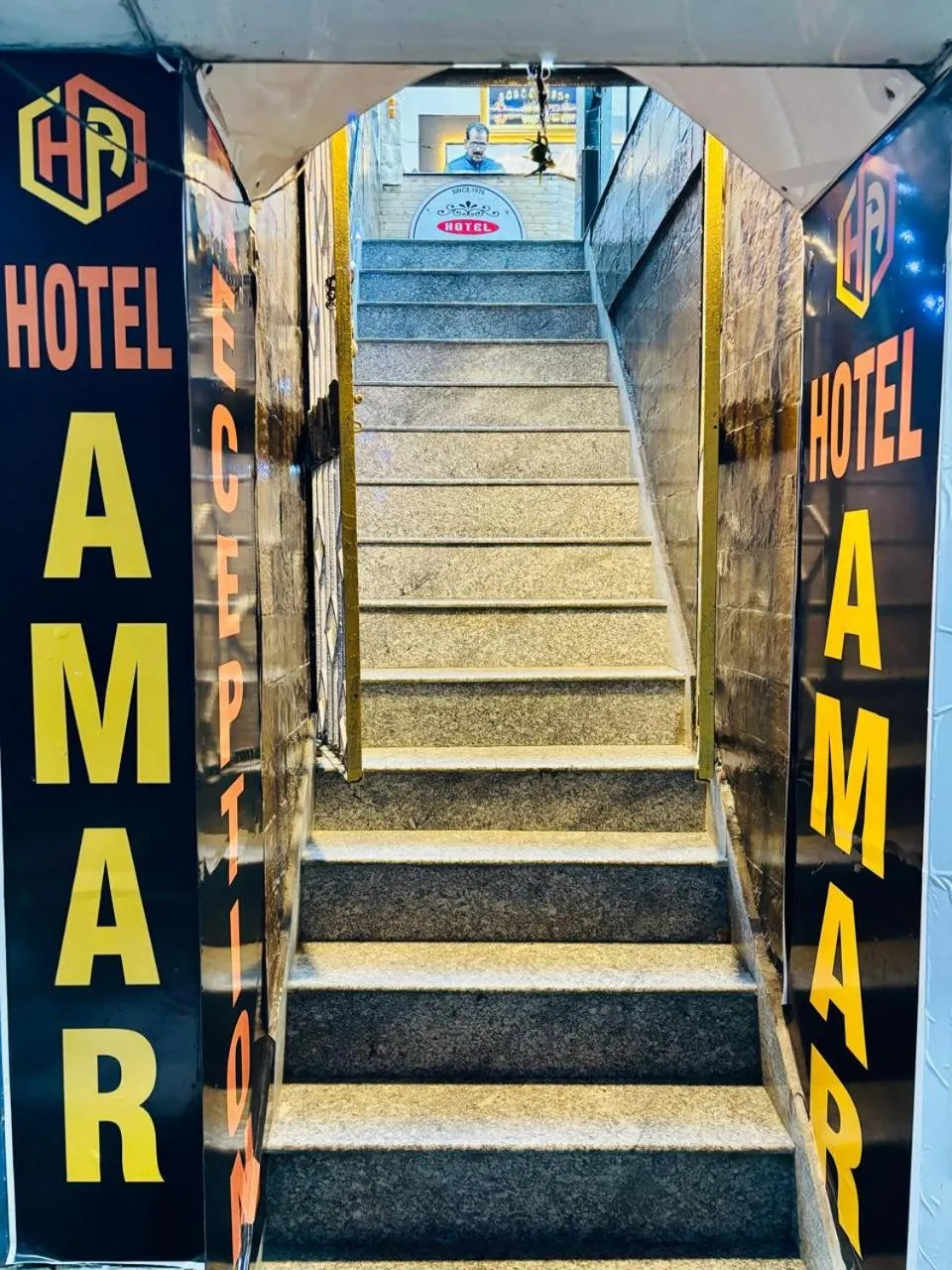 Property logo or sign in Hotel Amar
