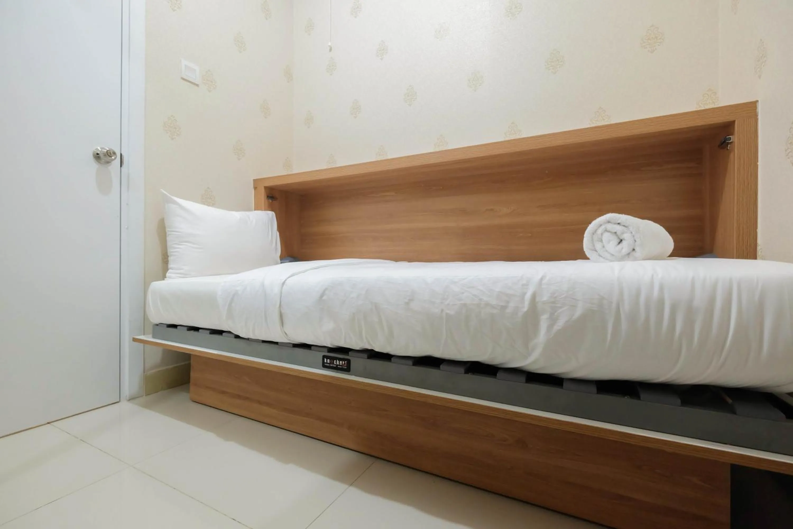 Bed in 2BR Apartment Green Pramuka City near Shopping Mall By Travelio