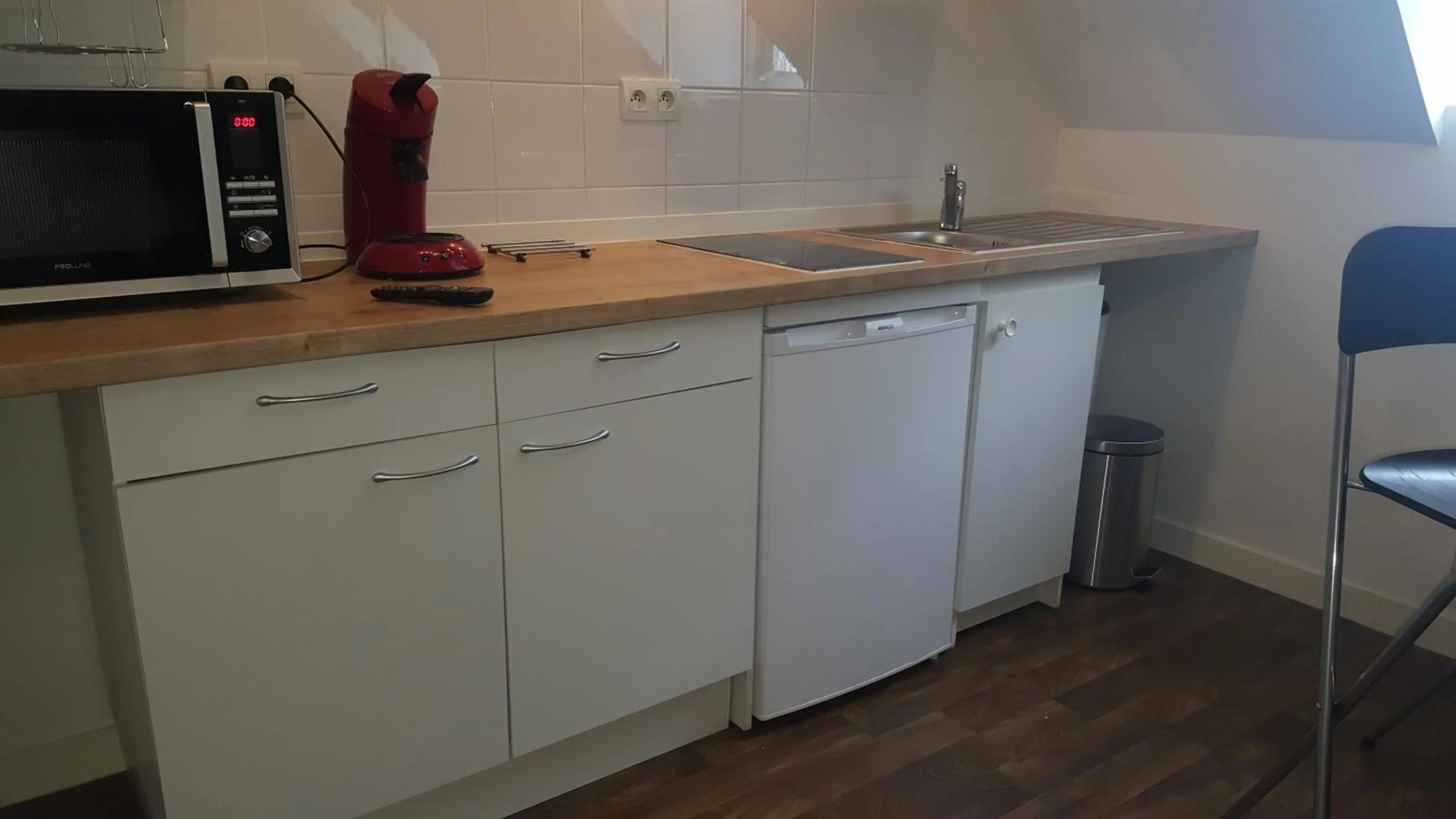 Kitchen or kitchenette in Au Pigeon Blanc