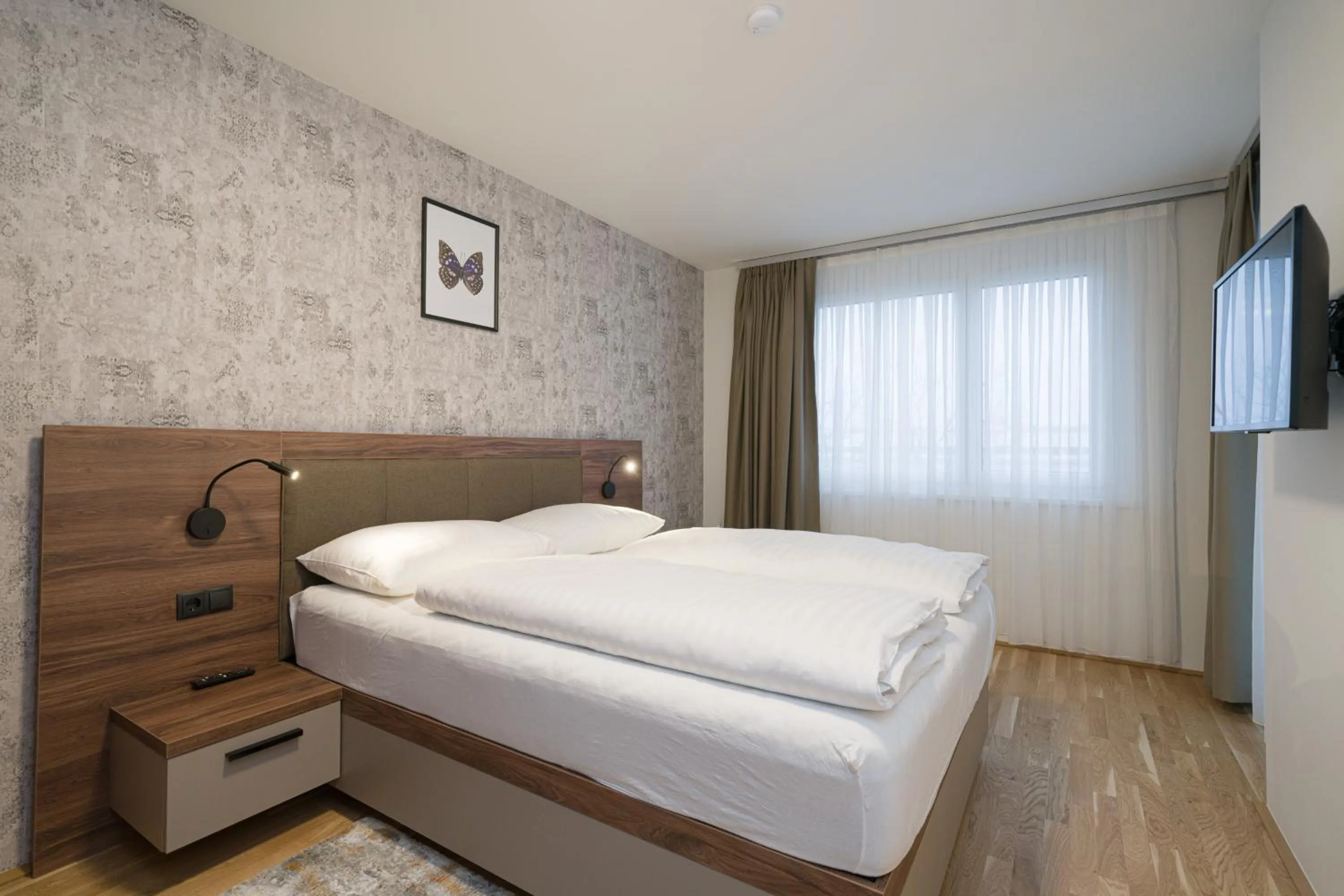 Communal lounge/ TV room, Bed in MyApartments Vienna