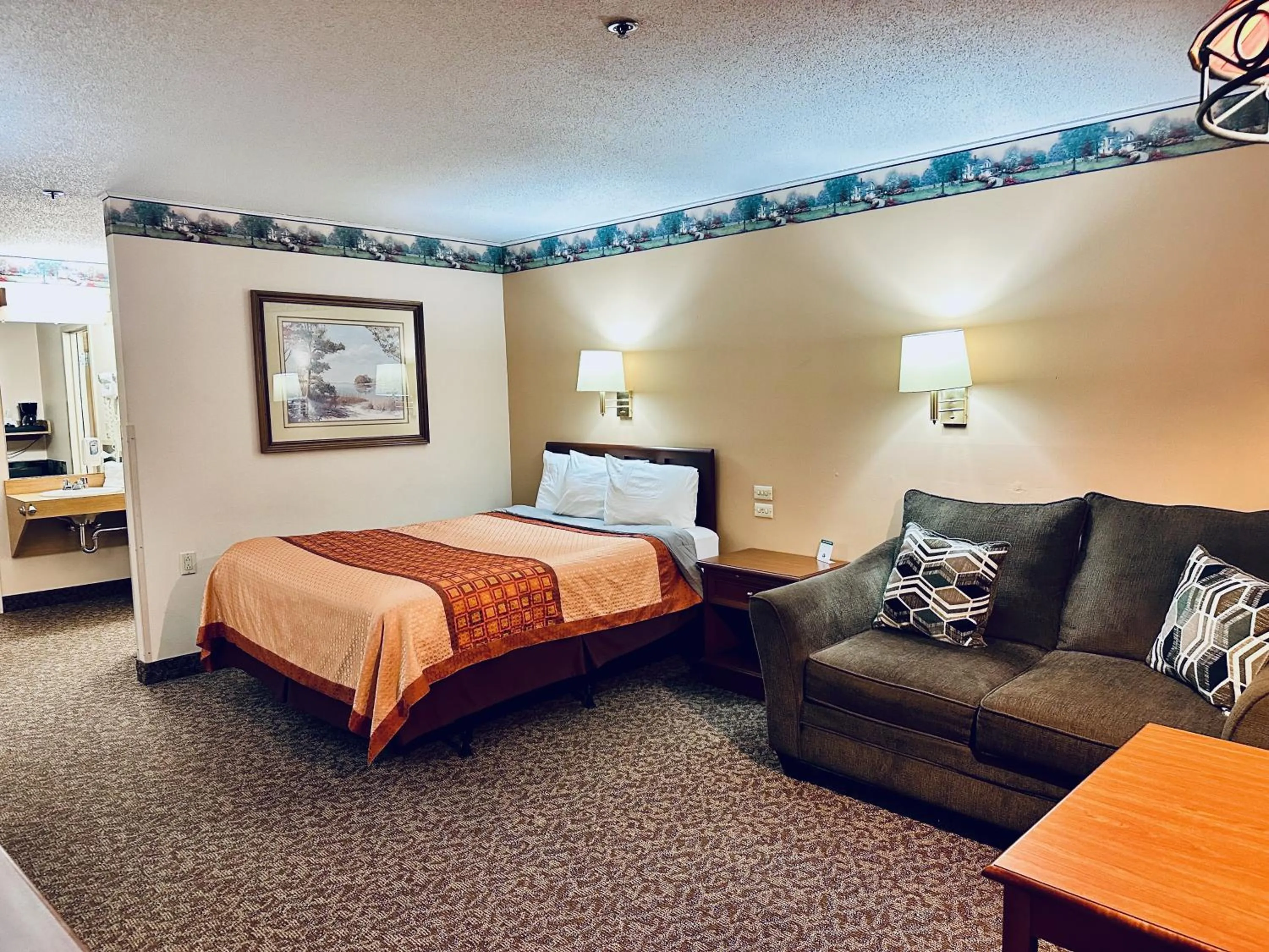 Seating area, Bed in Ivey's Motor Lodge