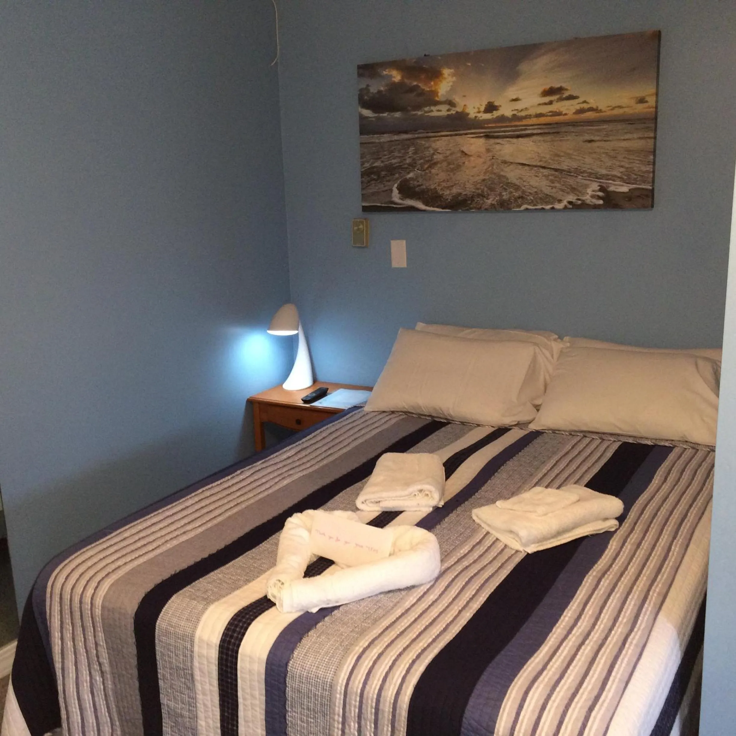 Bed in The New Oceanic Inn