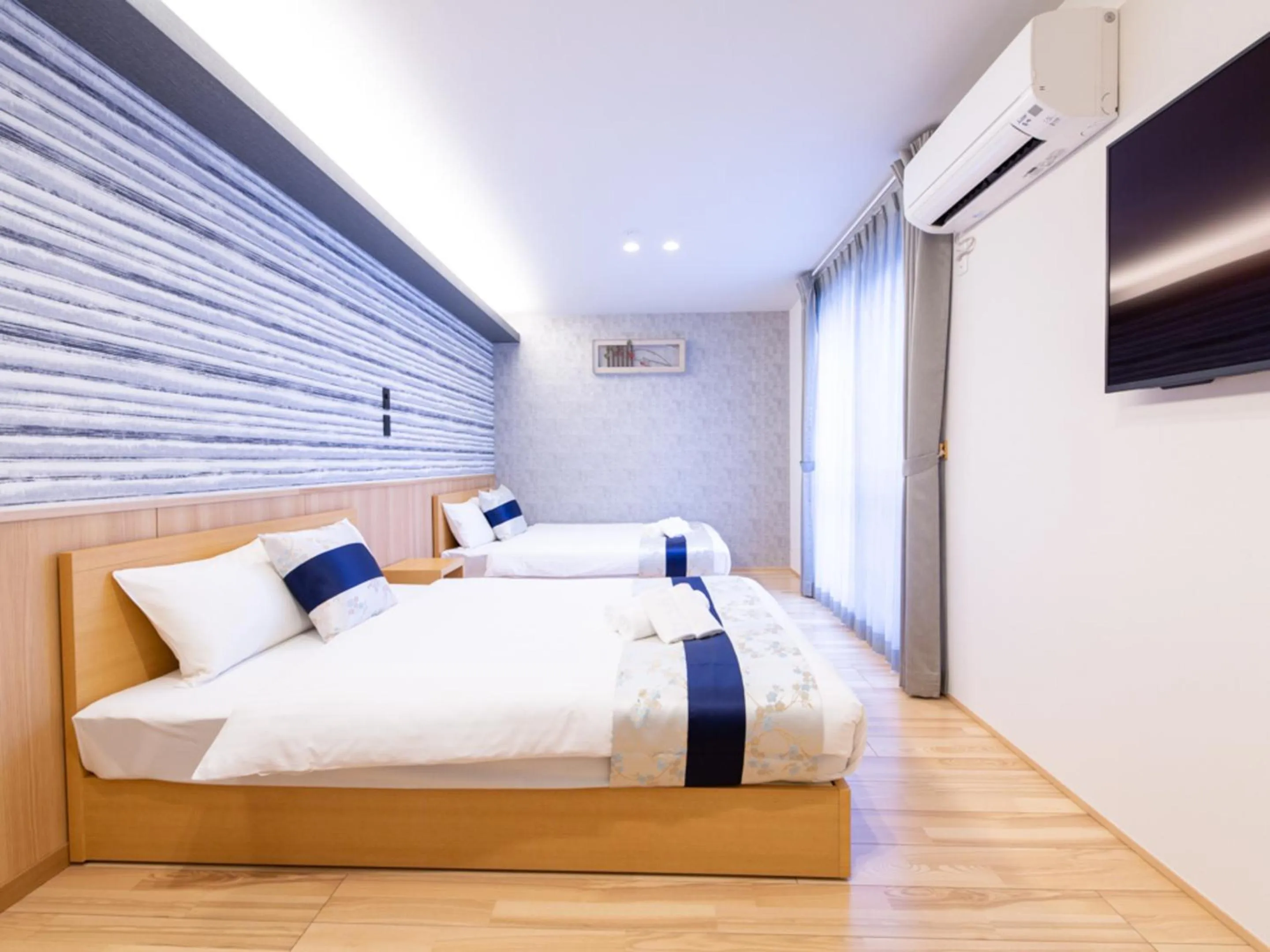 Bed in GRAND BASE Hiroshima Hikarimachi