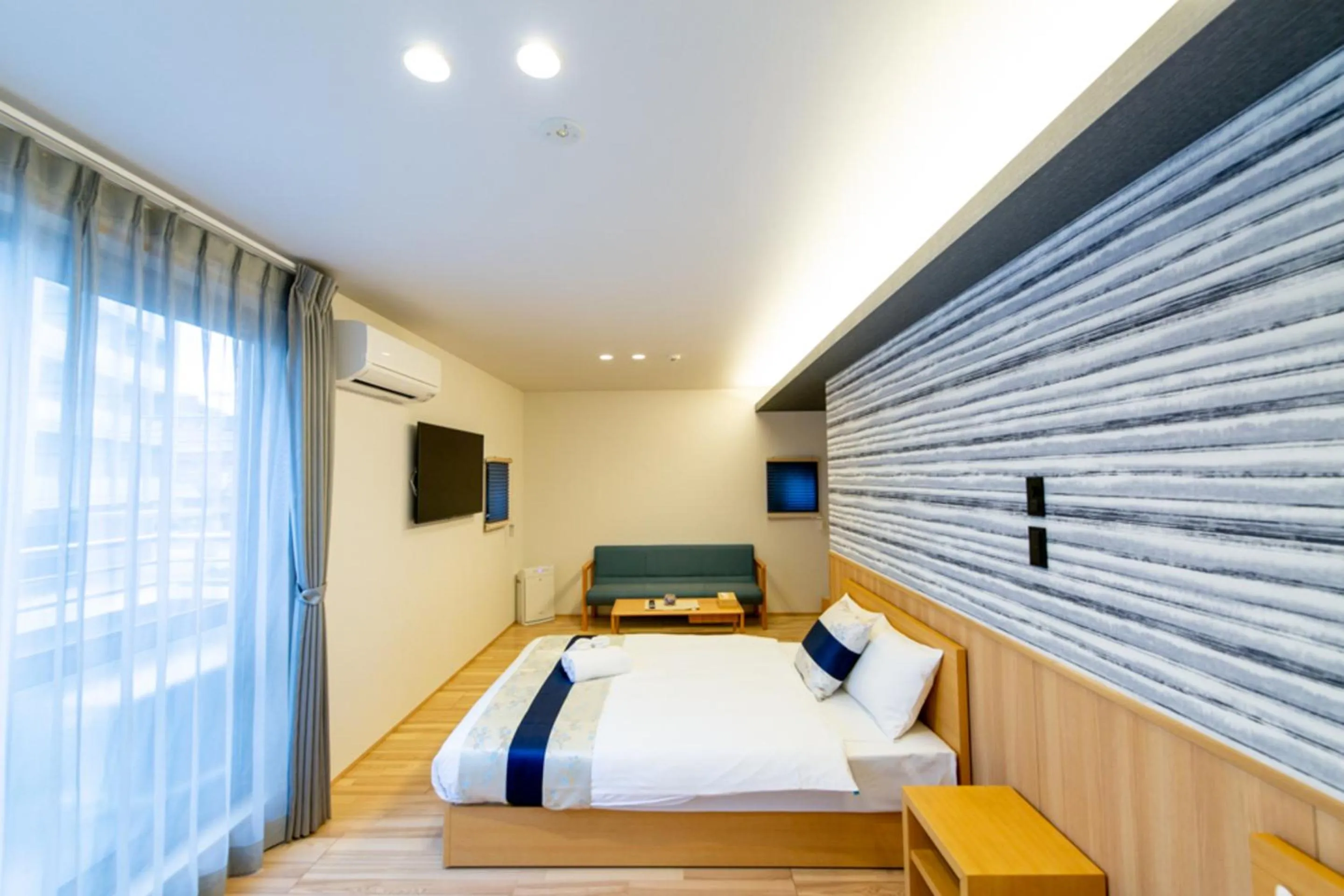 Photo of the whole room, Bed in GRAND BASE Hiroshima Hikarimachi