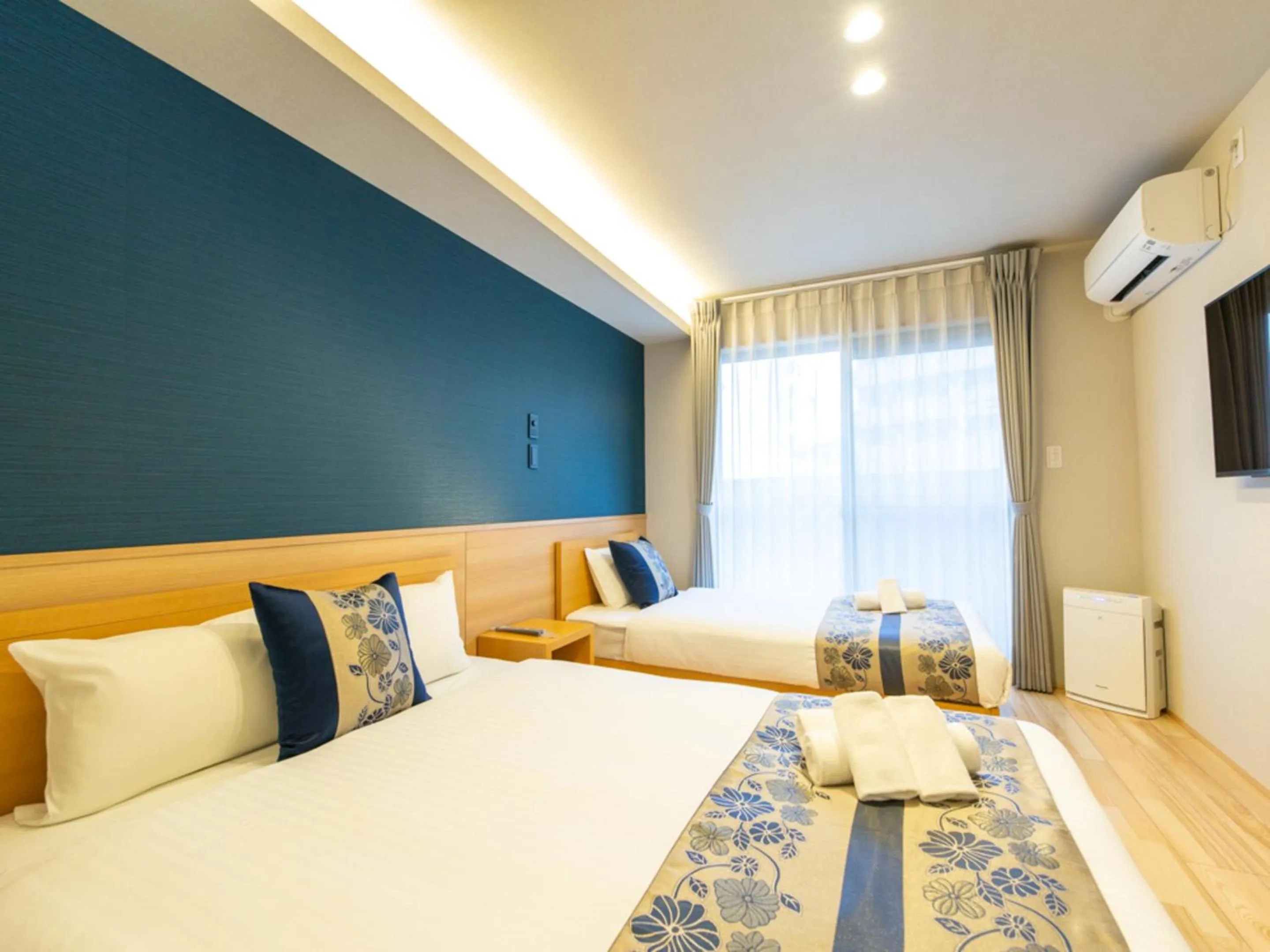 Photo of the whole room, Bed in GRAND BASE Hiroshima Hikarimachi