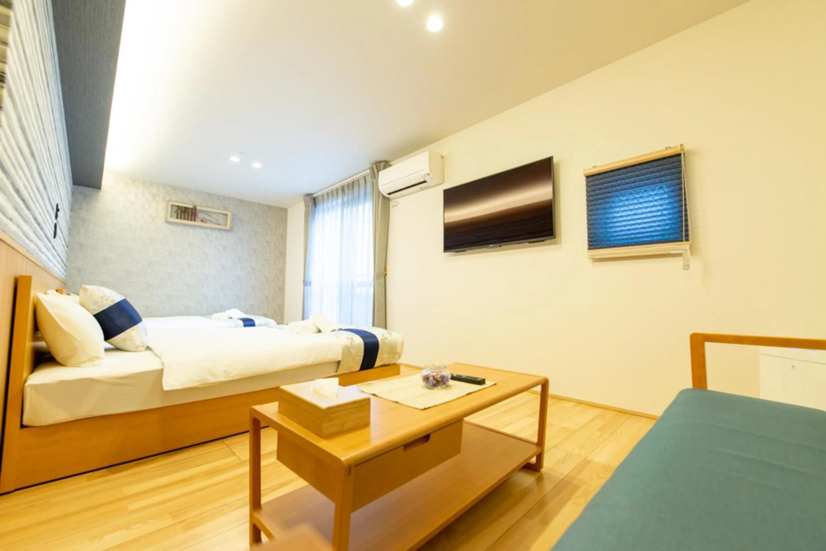 Photo of the whole room, Bed in GRAND BASE Hiroshima Hikarimachi