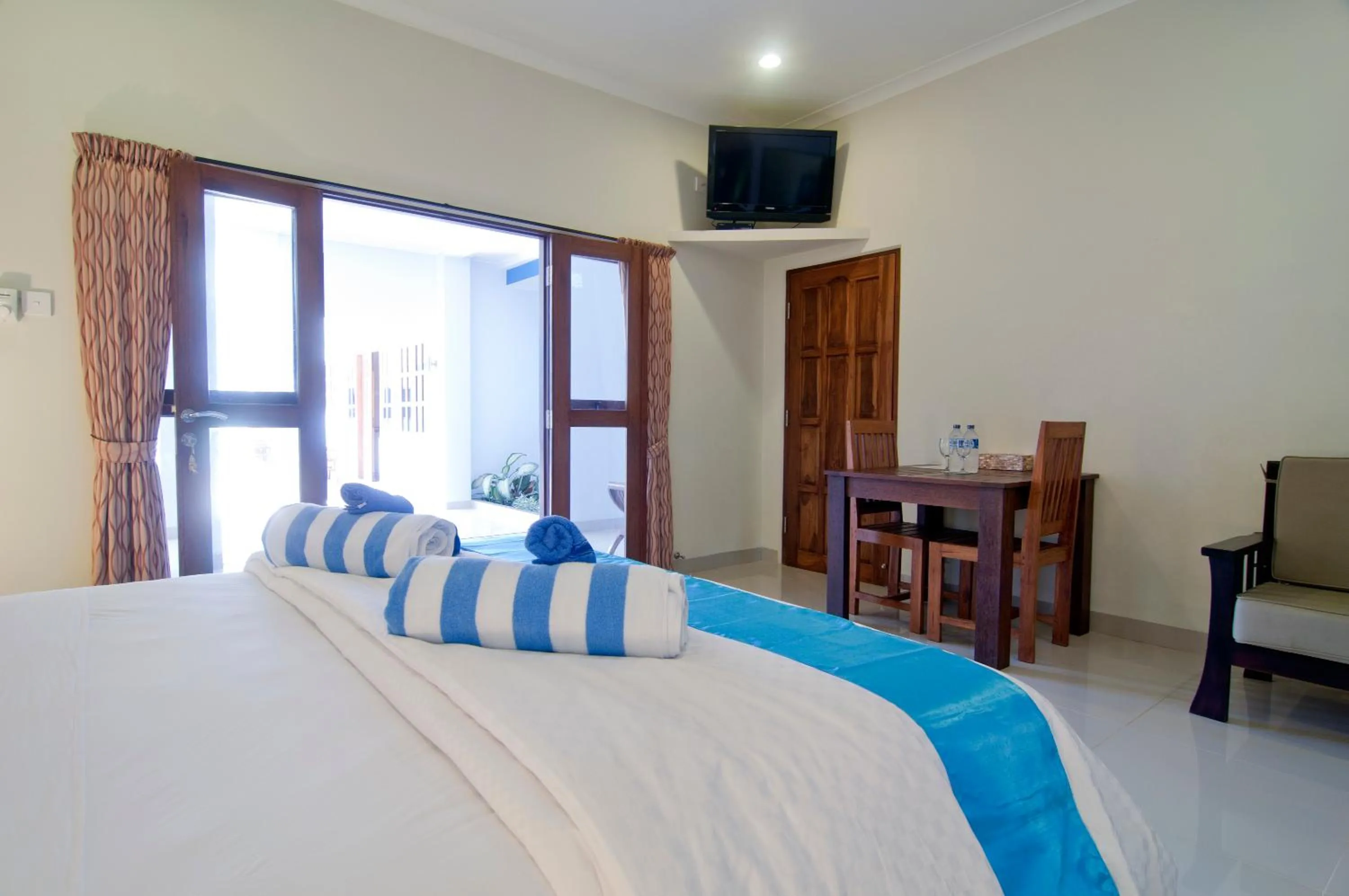 Bed in Lovina Oasis Hotel