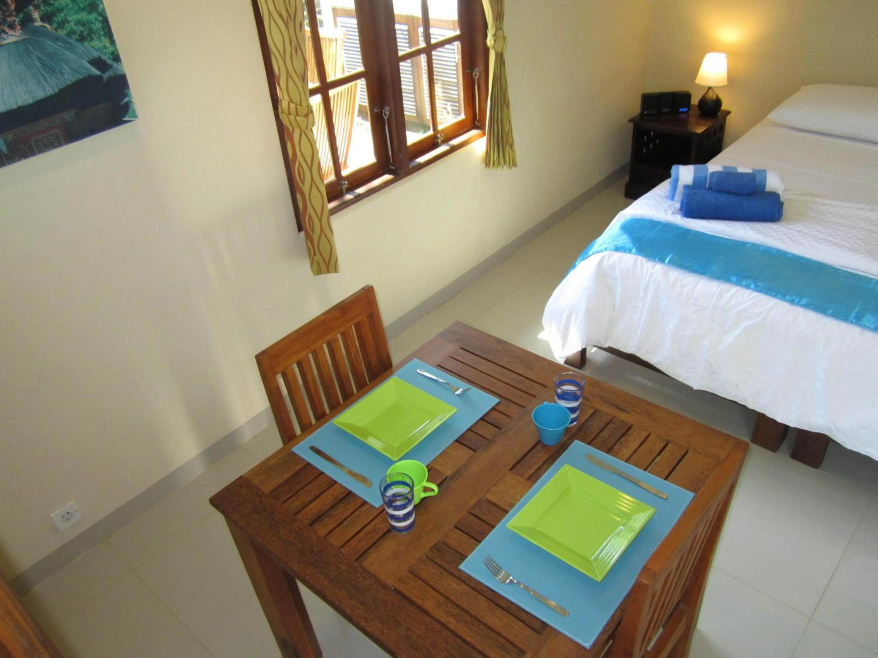 Seating area, Bed in Lovina Oasis Hotel